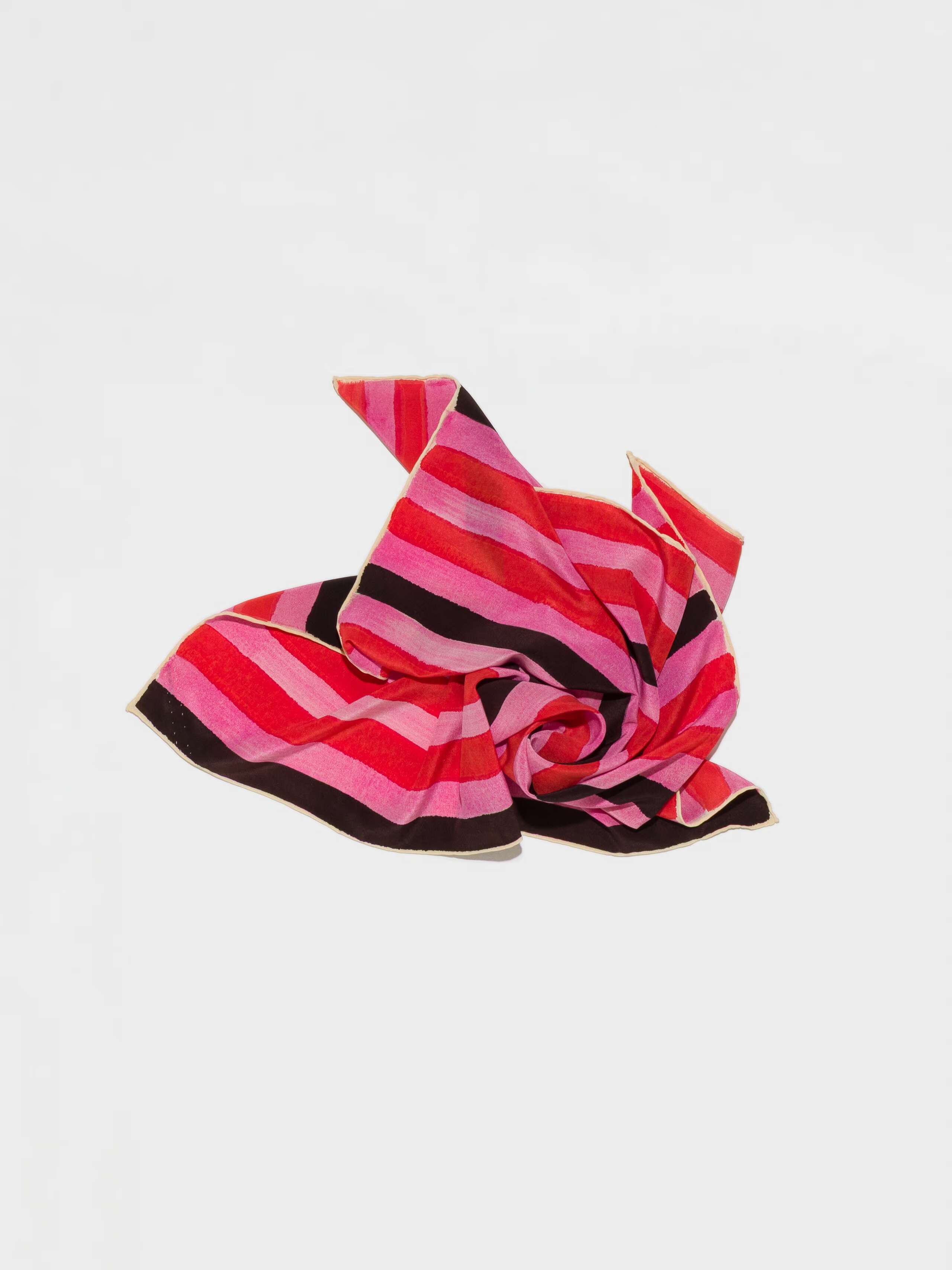 Product Shot of Handpainted Stripes Foulard in Pink casually laid out