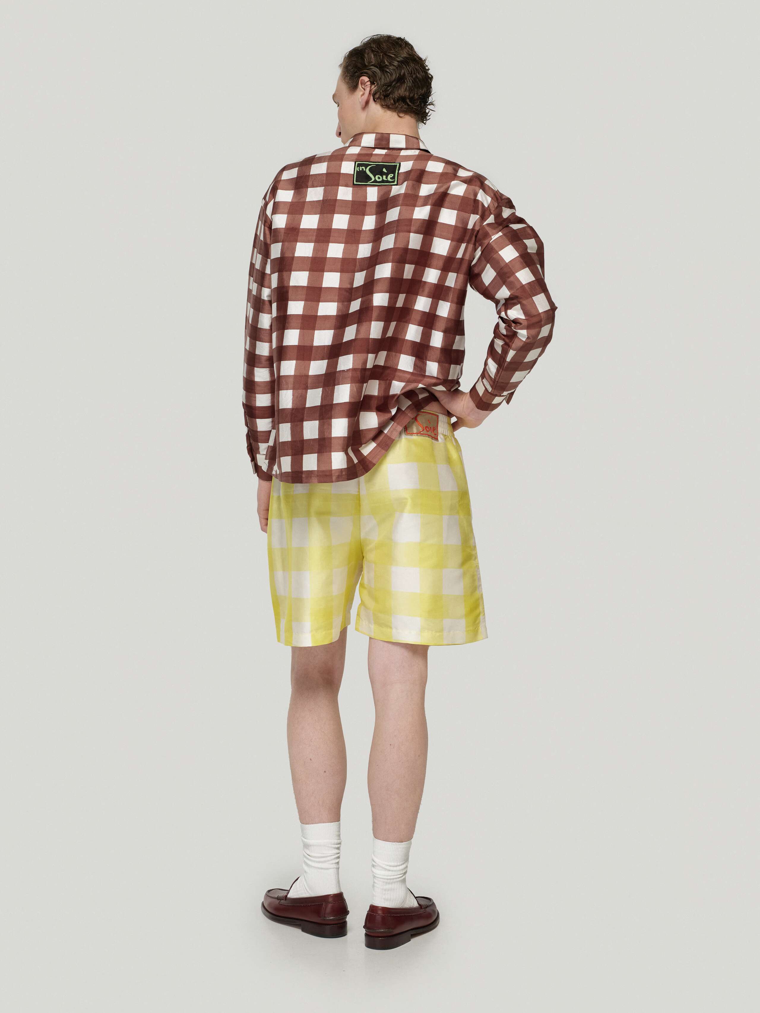 Male model wearing Francesca blouse in brown and allen shorts in yellow