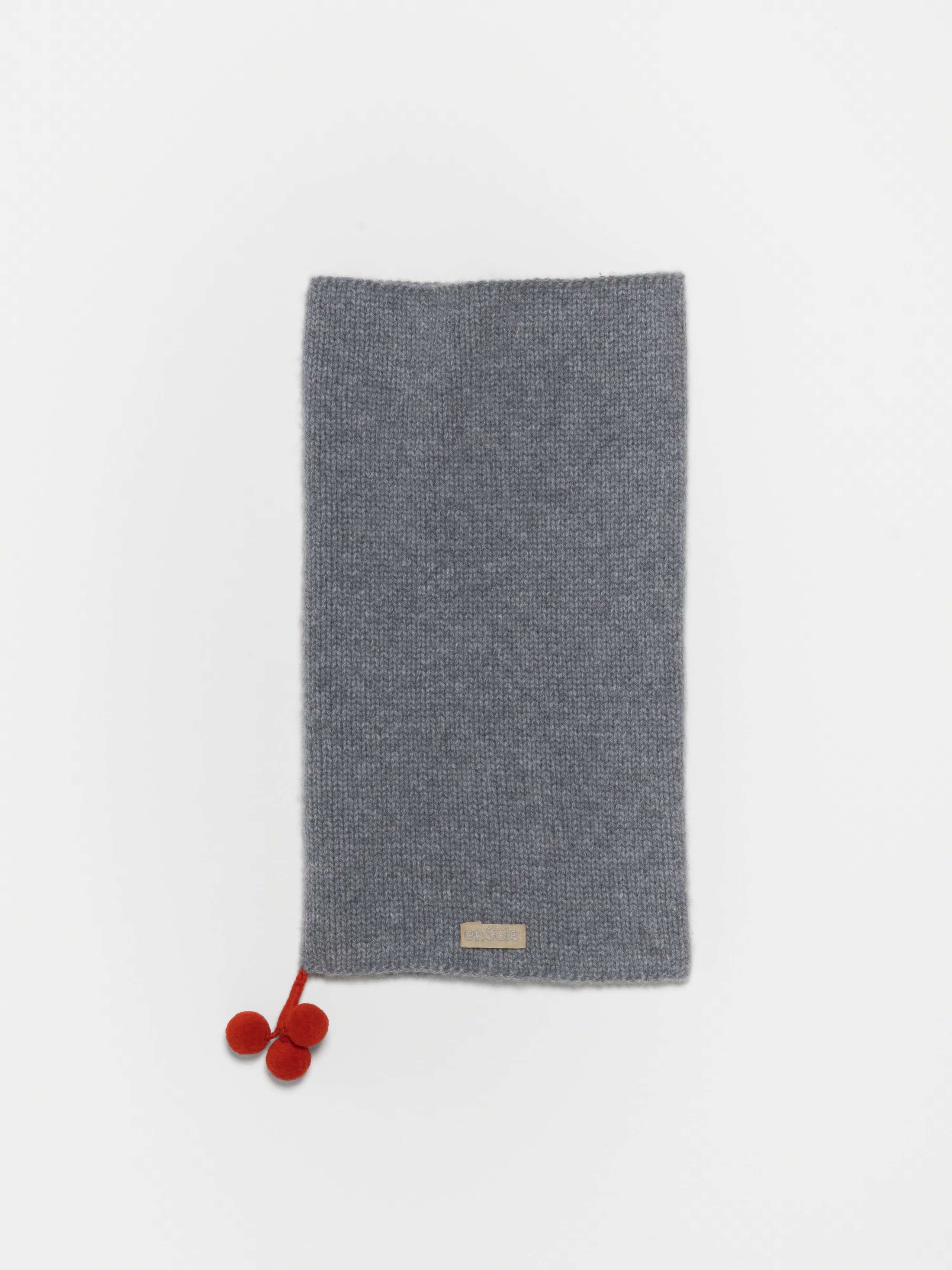 Detail Shot of Yul Tube Hat Pompons in Grey
