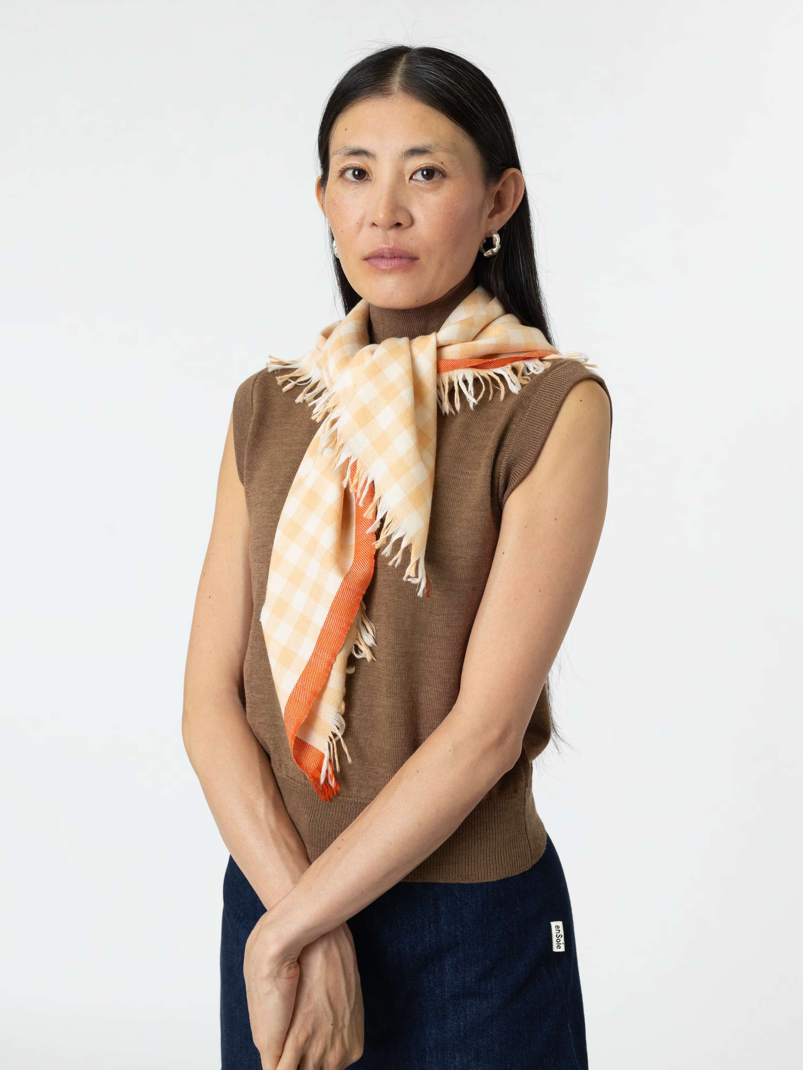 Model wearing Saga Scarf 85 in Toffee Beige