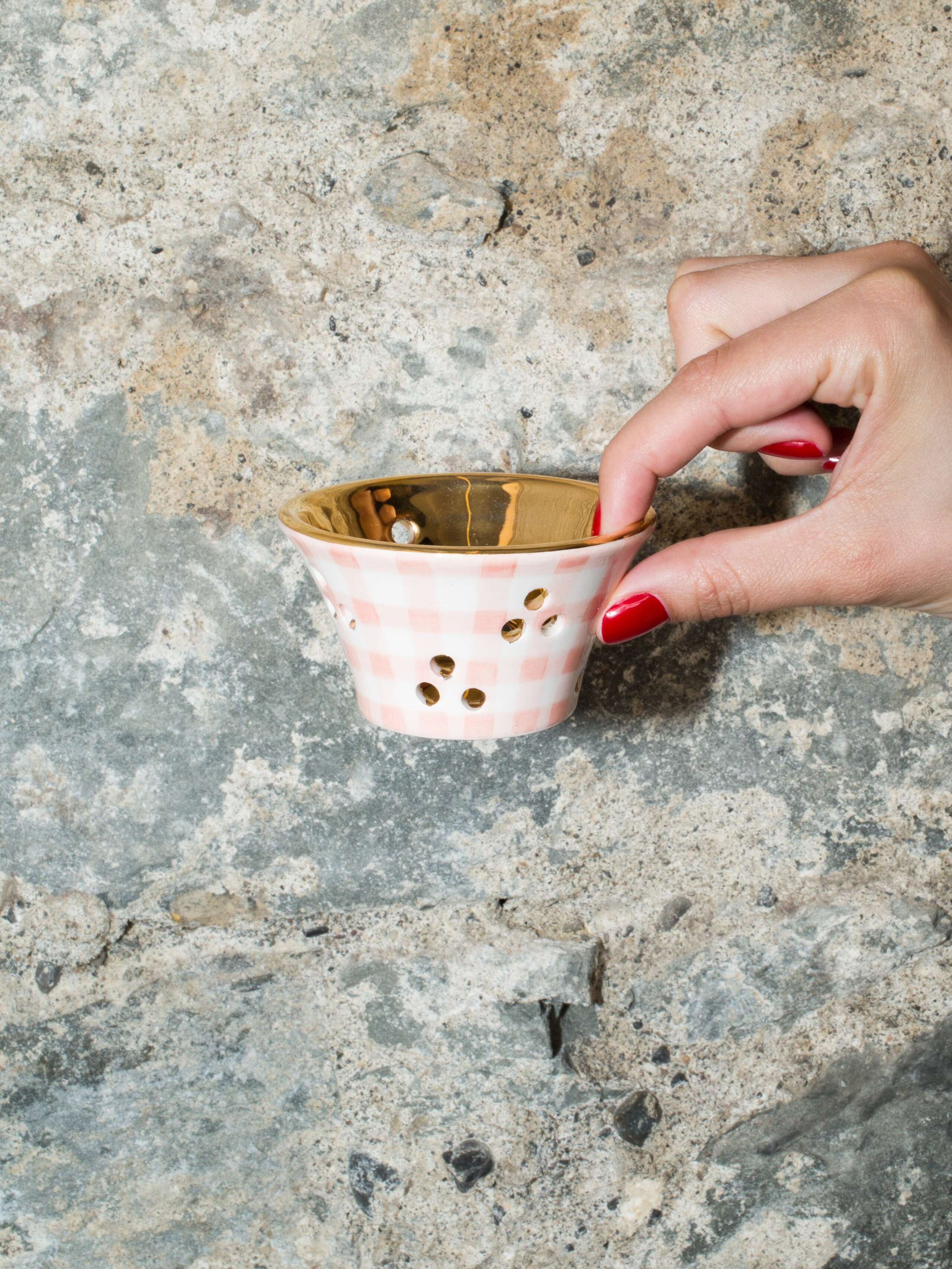 person holding tea light 