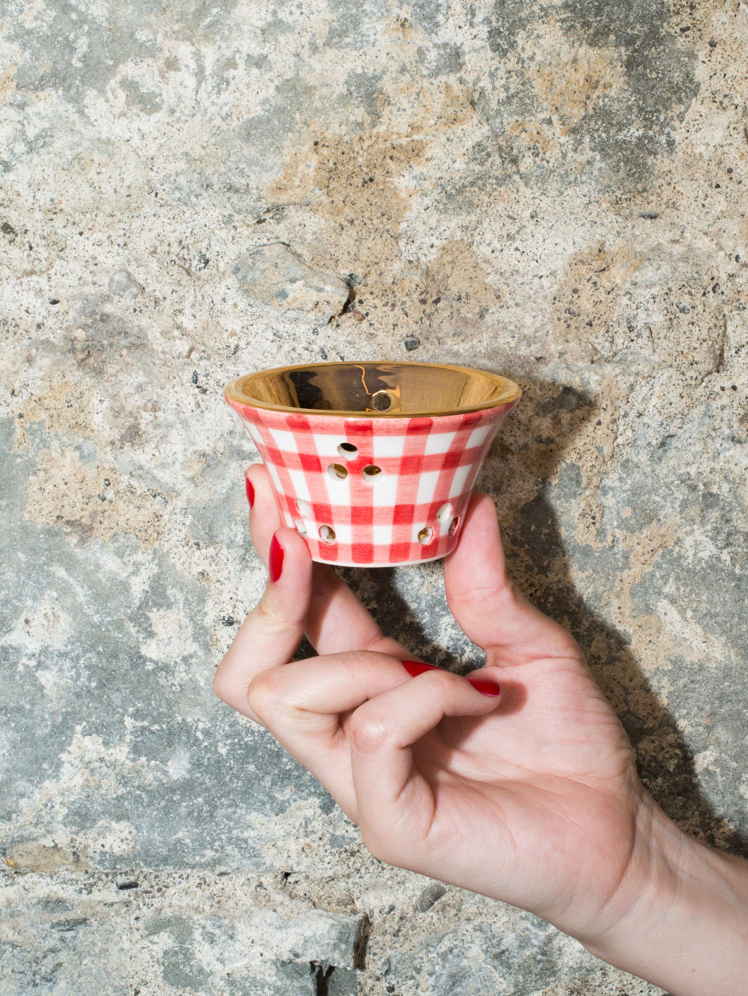 person holding tealight