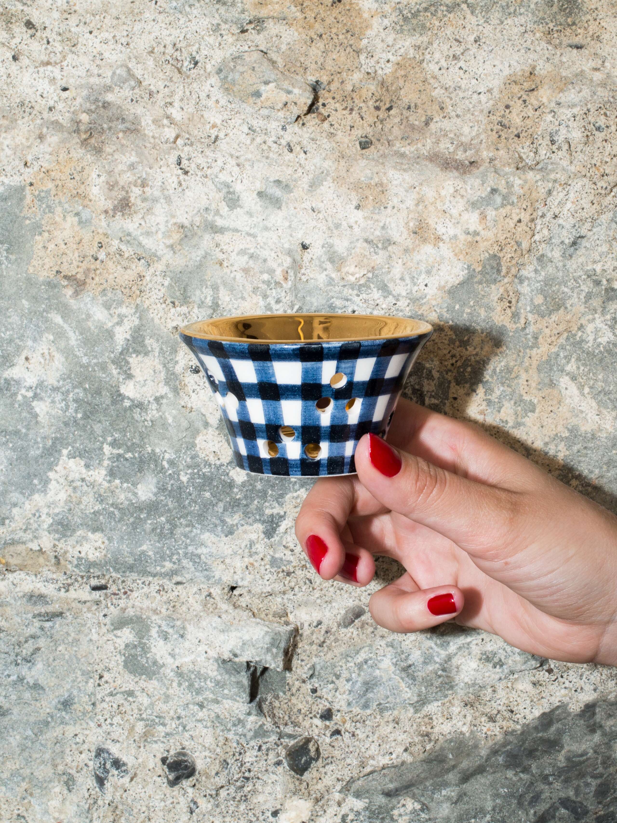 person holding tealight