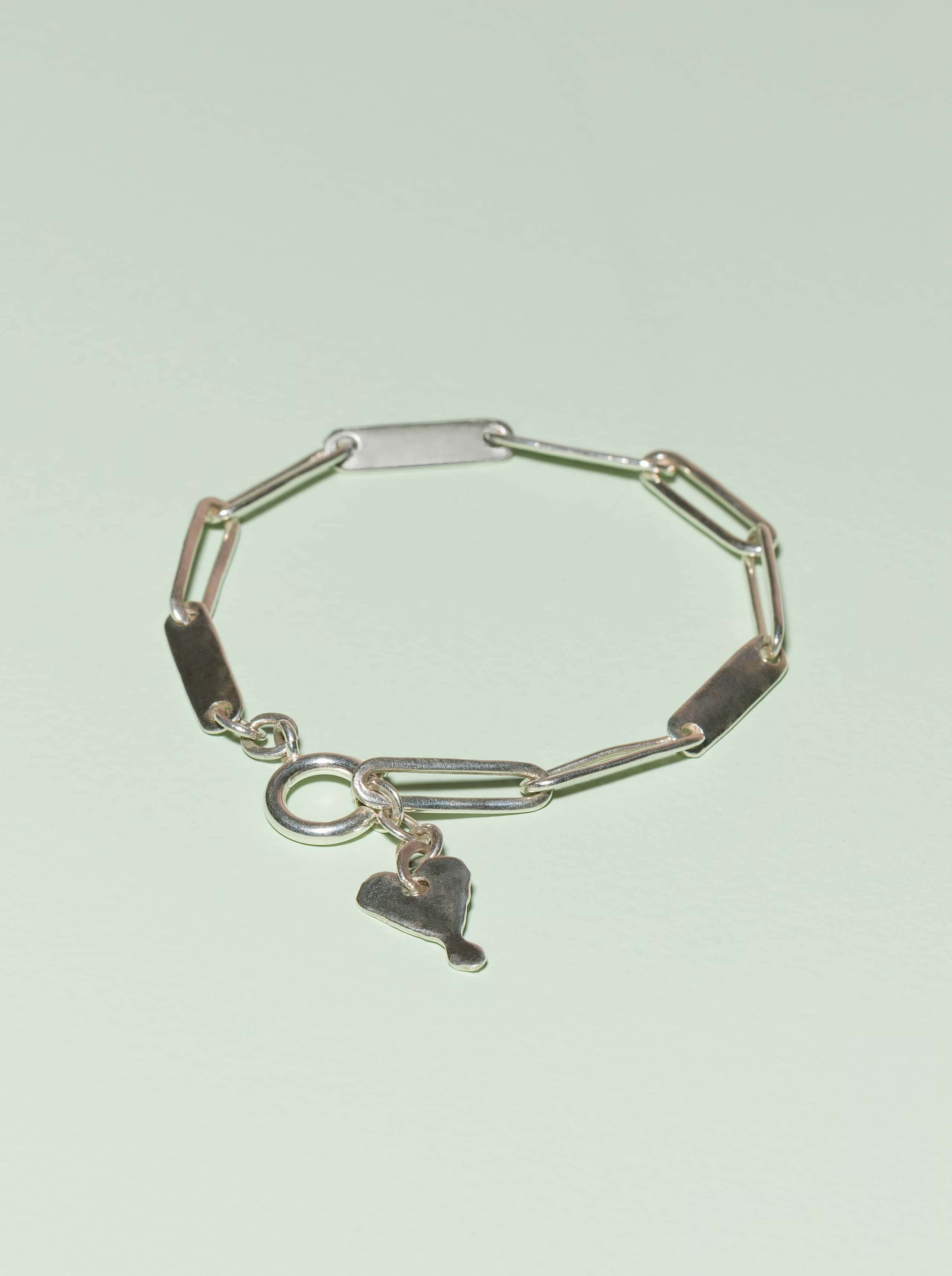 harper bracelet on green background