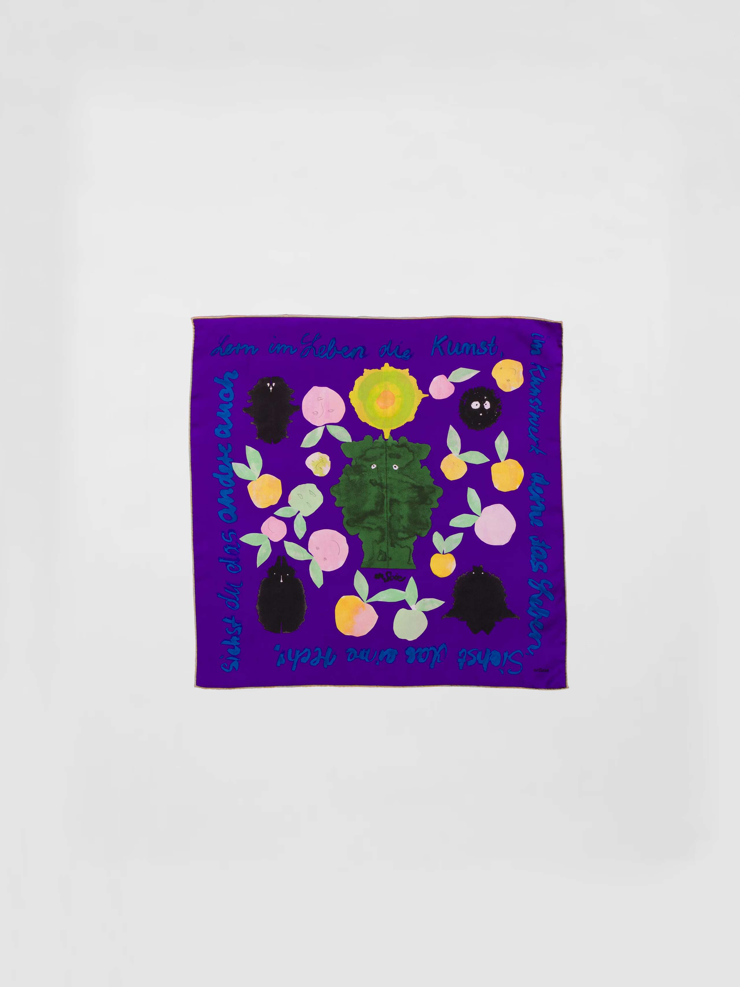 Picture of a purple silk foulard featuring a colourful apple print
