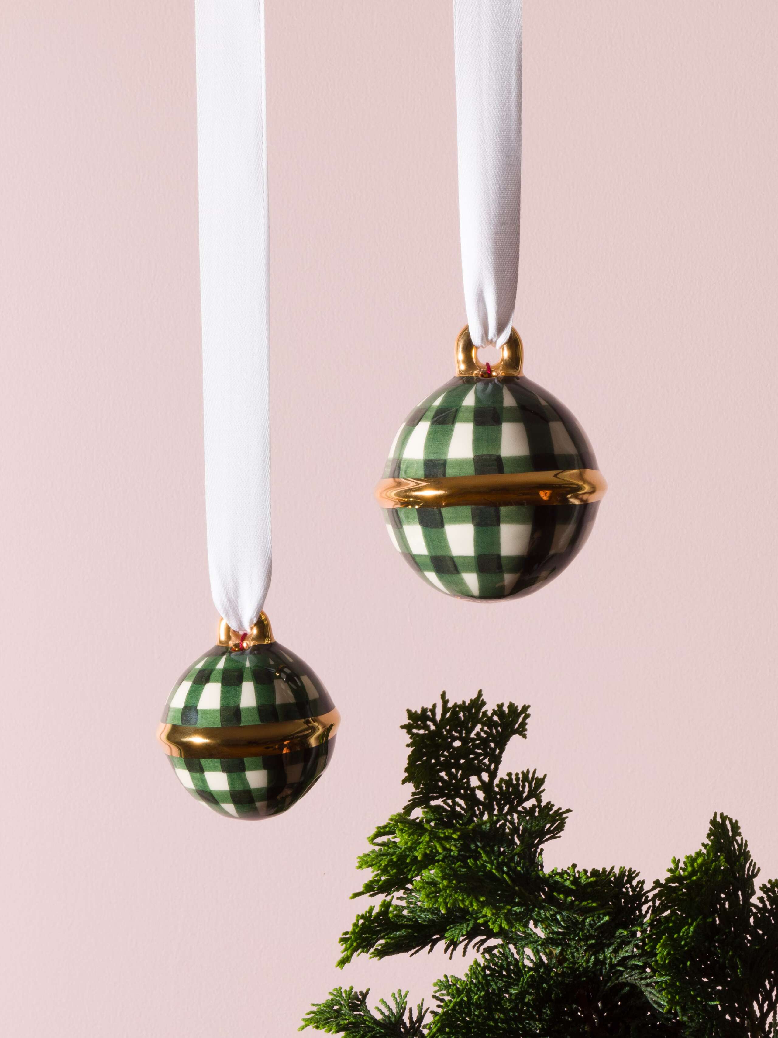 Picture of two swiss bell christmas tree ornaments featuring a stunning dark green check pattern
