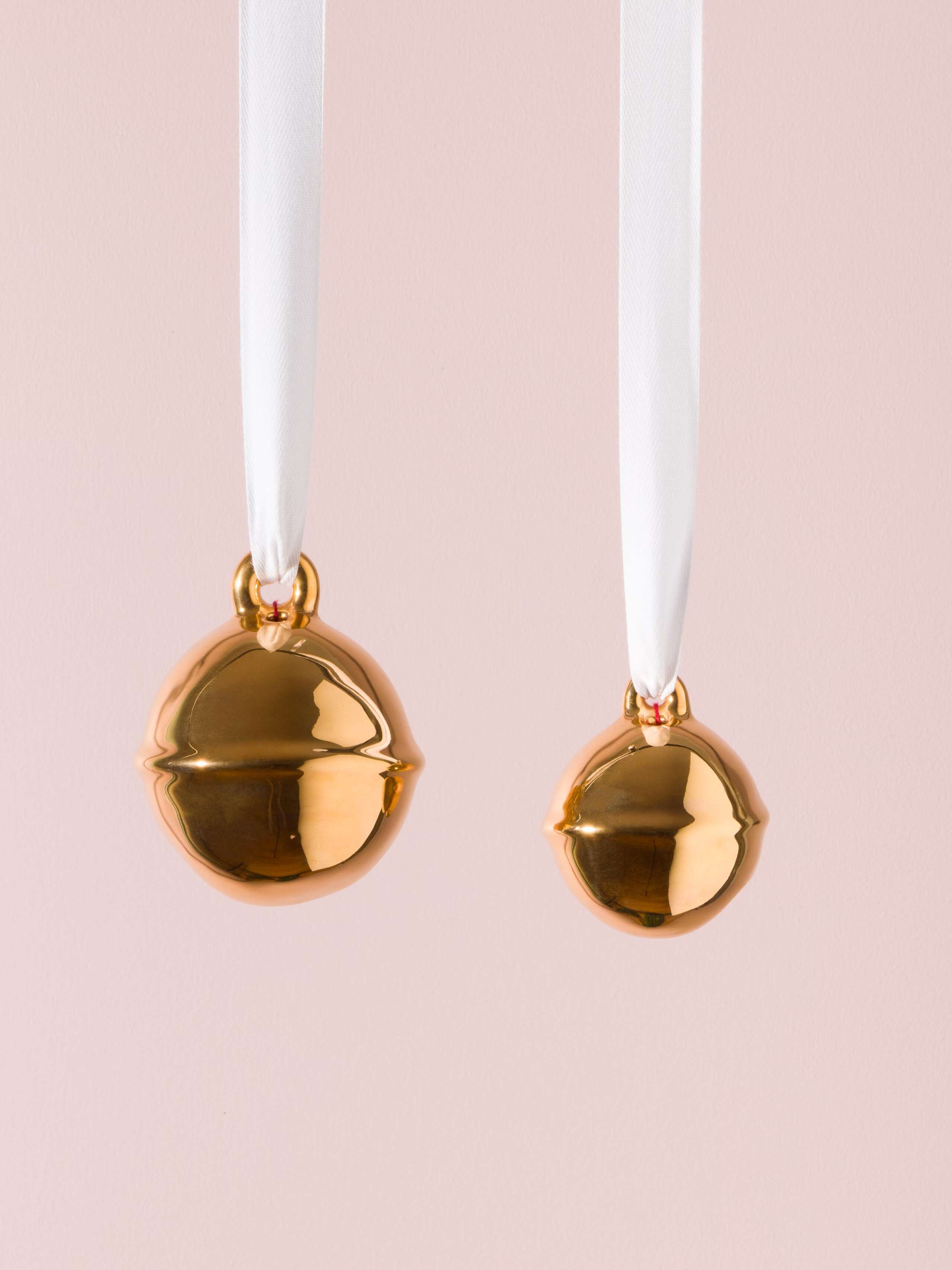 Picture of two golden swiss bell christmas tree ornaments 