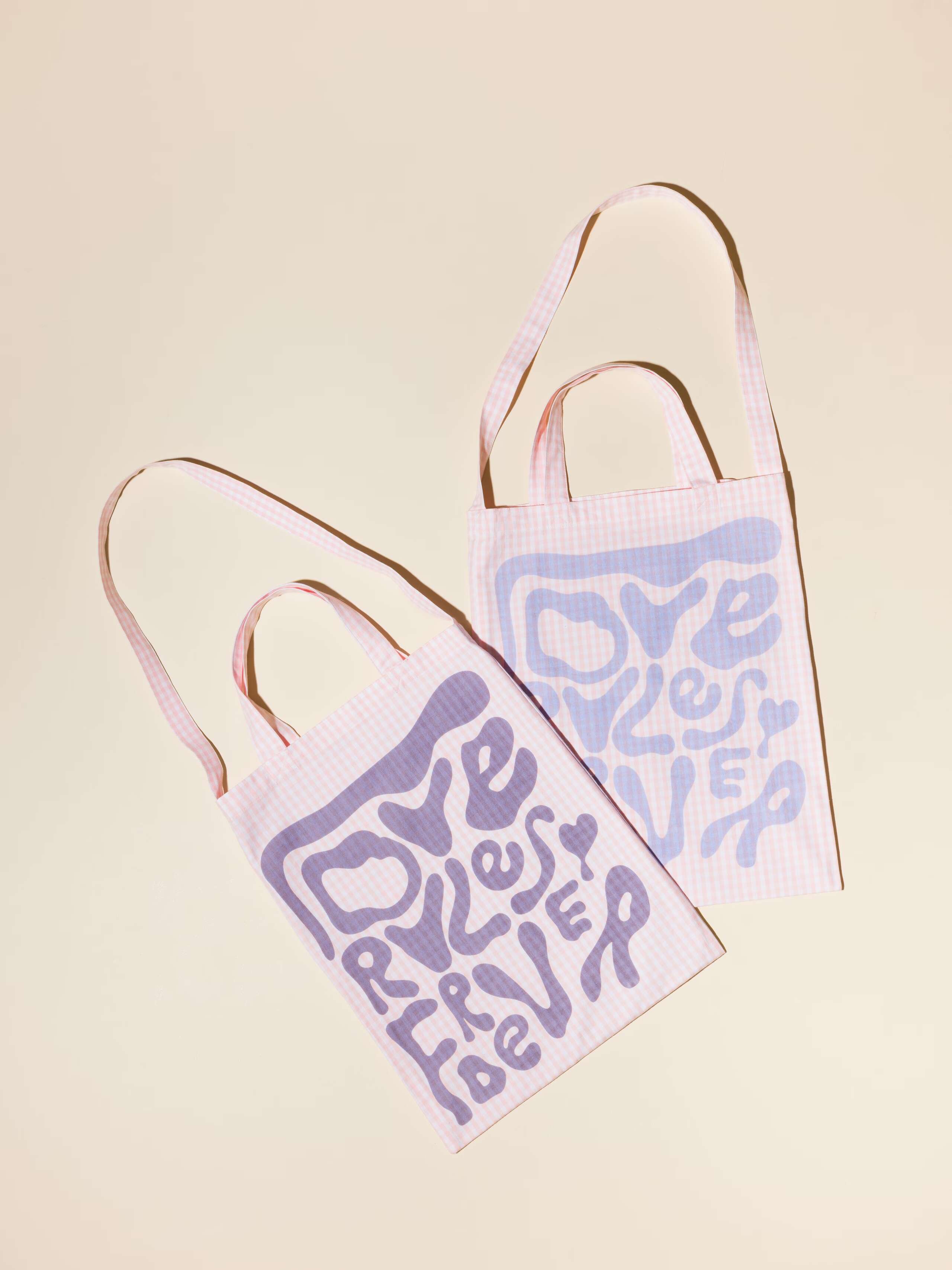 picture of two carry all bags in candy pink Vichy