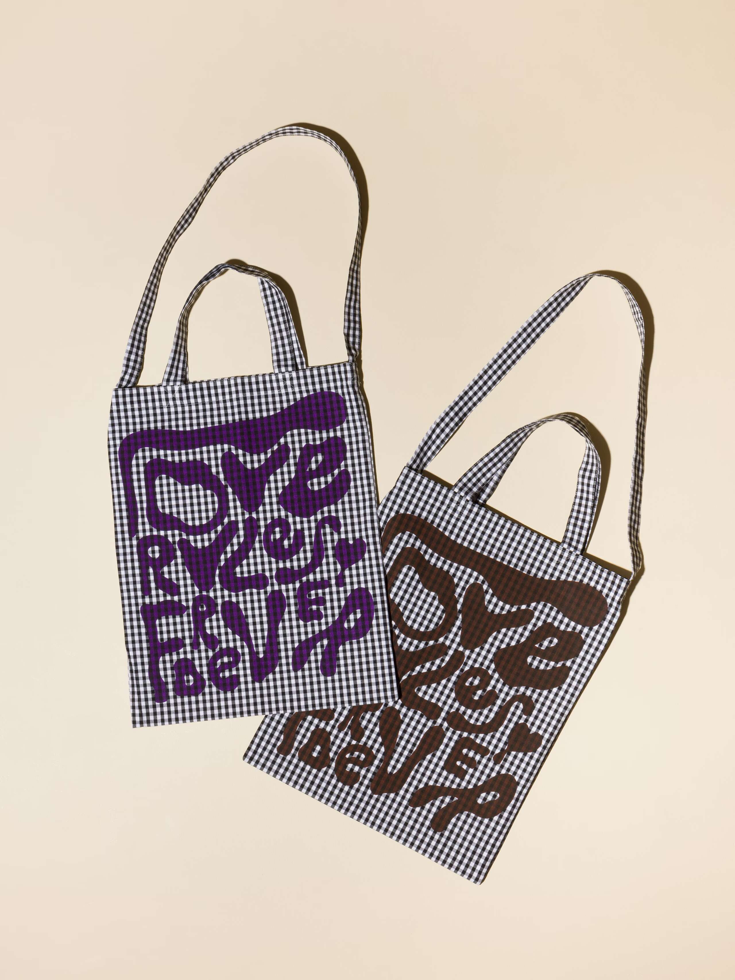 picture of two carry all bags in black Vichy