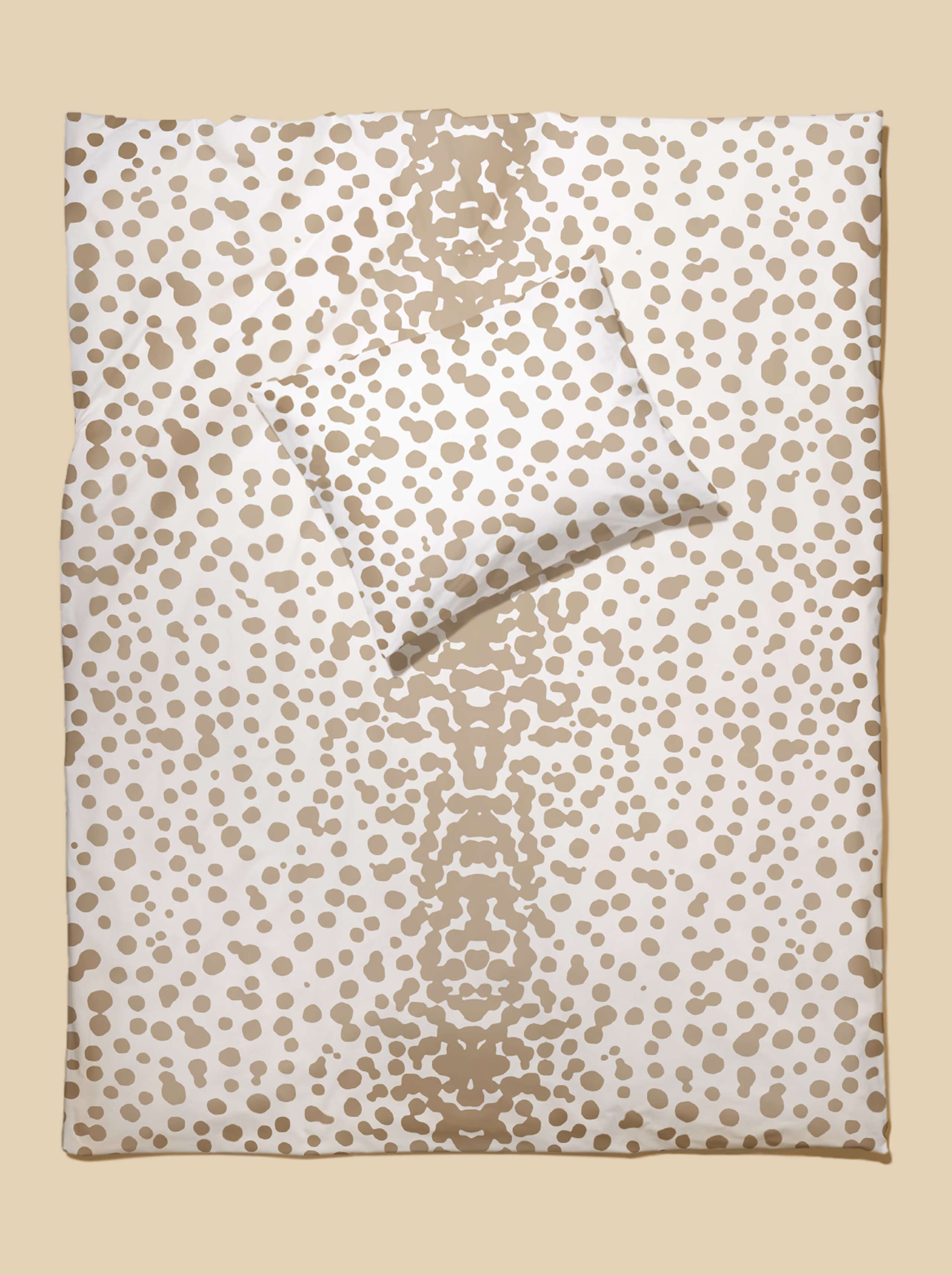 Picture of bed linen featuring a beautiful leo dot pattern in beige