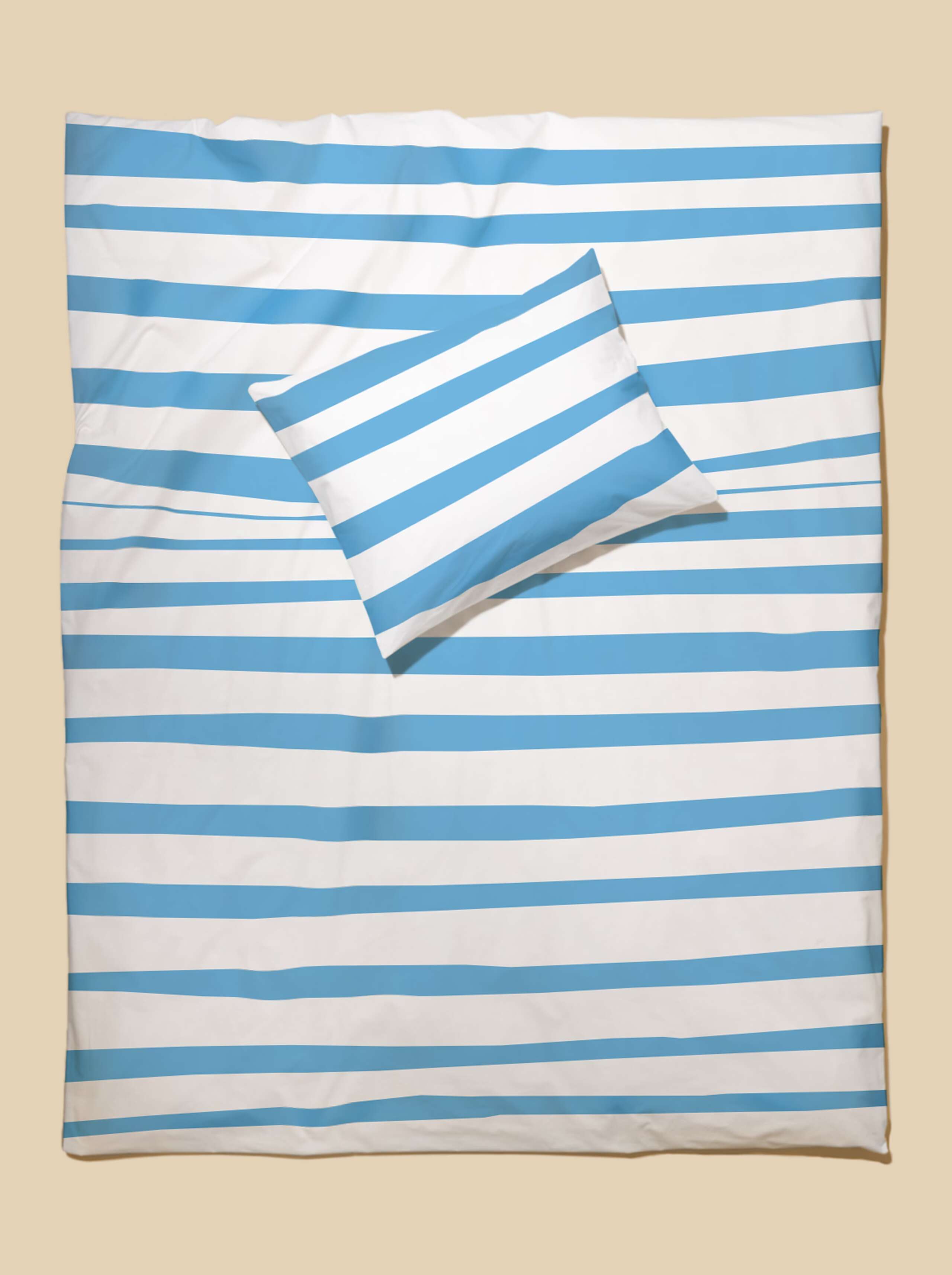 Picture of bed linen featuring a beautiful stripe pattern in light blue