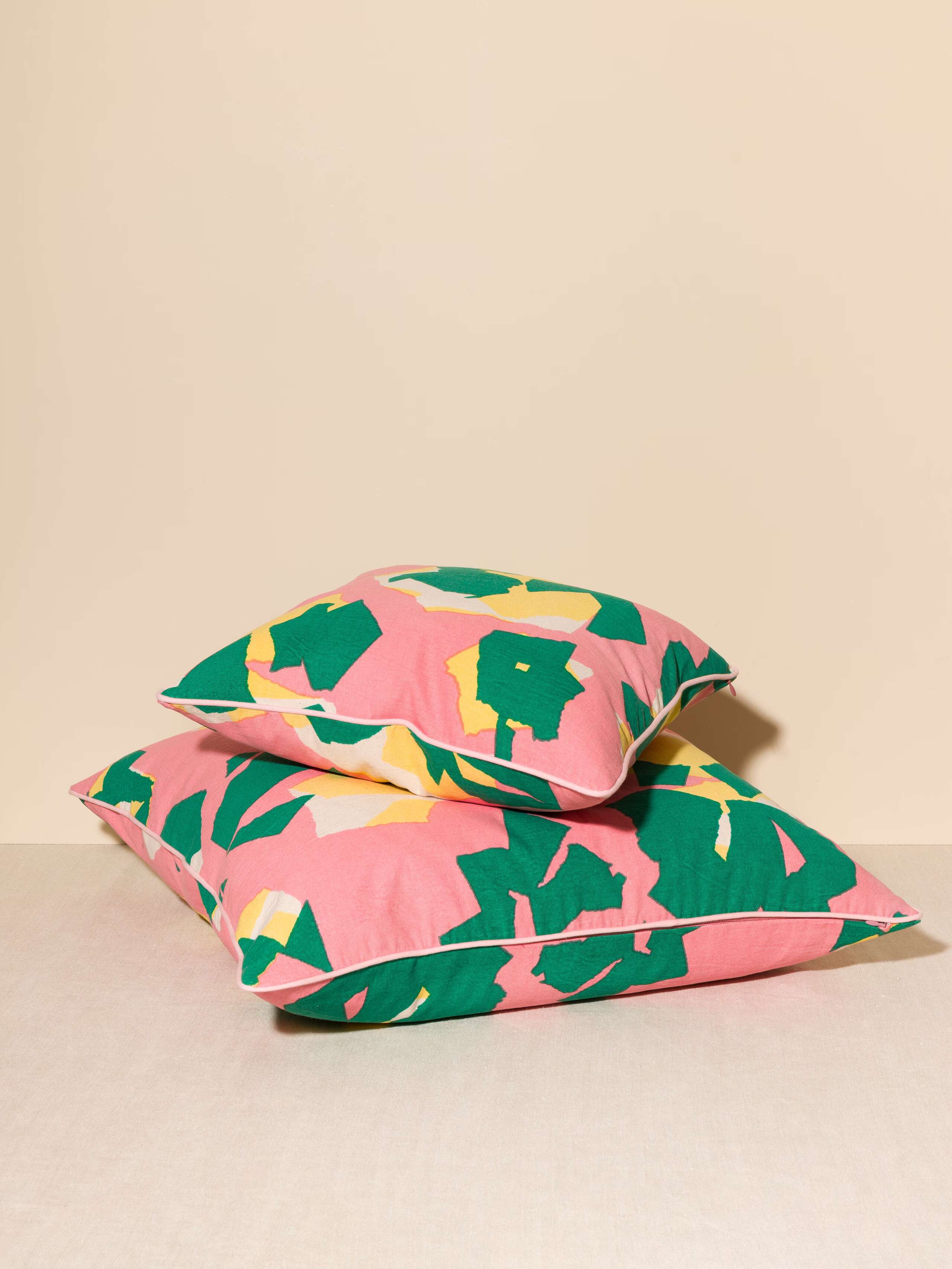 Picture of the Terrazzo Pillow covers printed in pink yellow and green