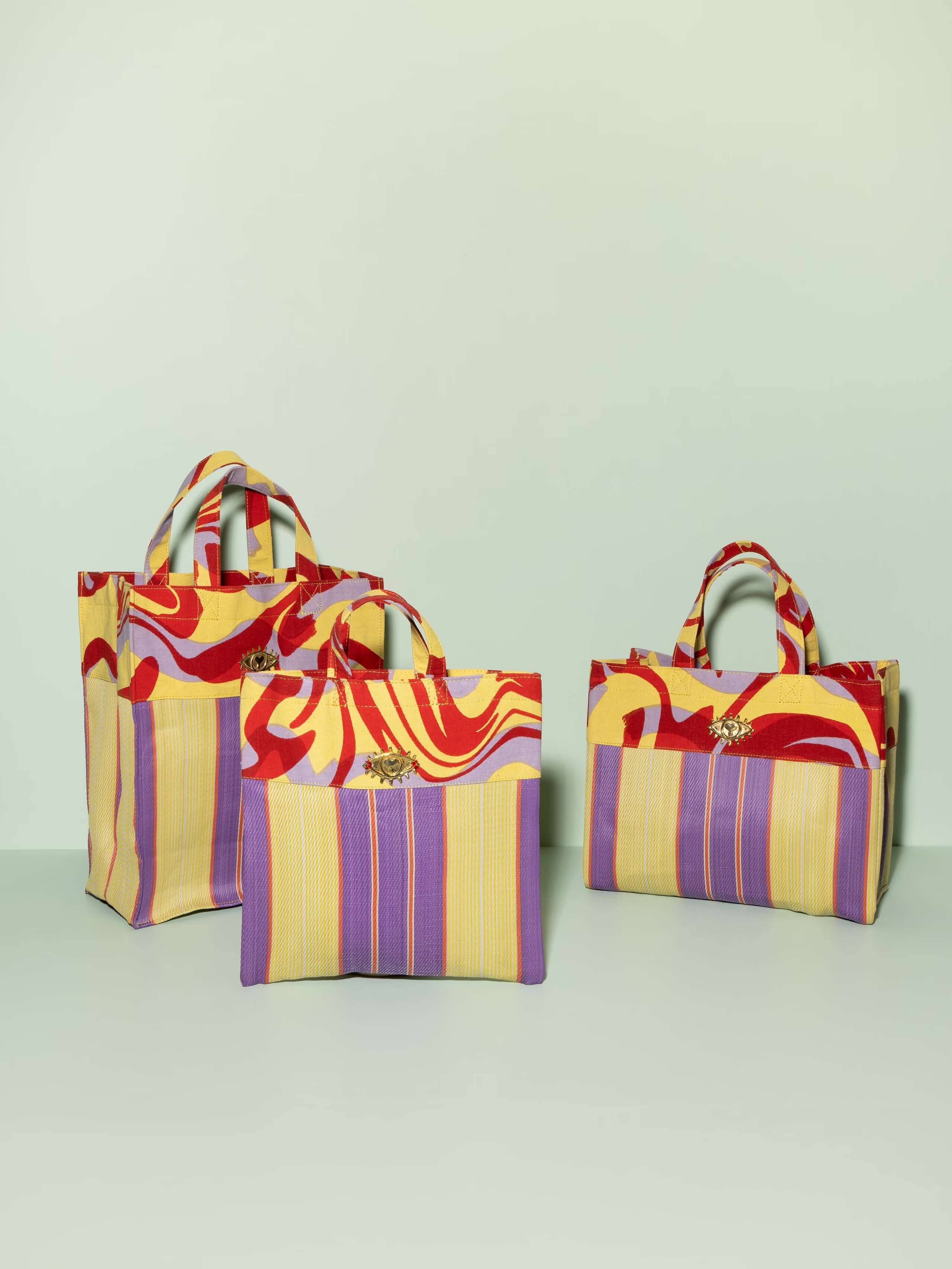 Elgin Road bag in three colours and summer colours of red purple and yellow