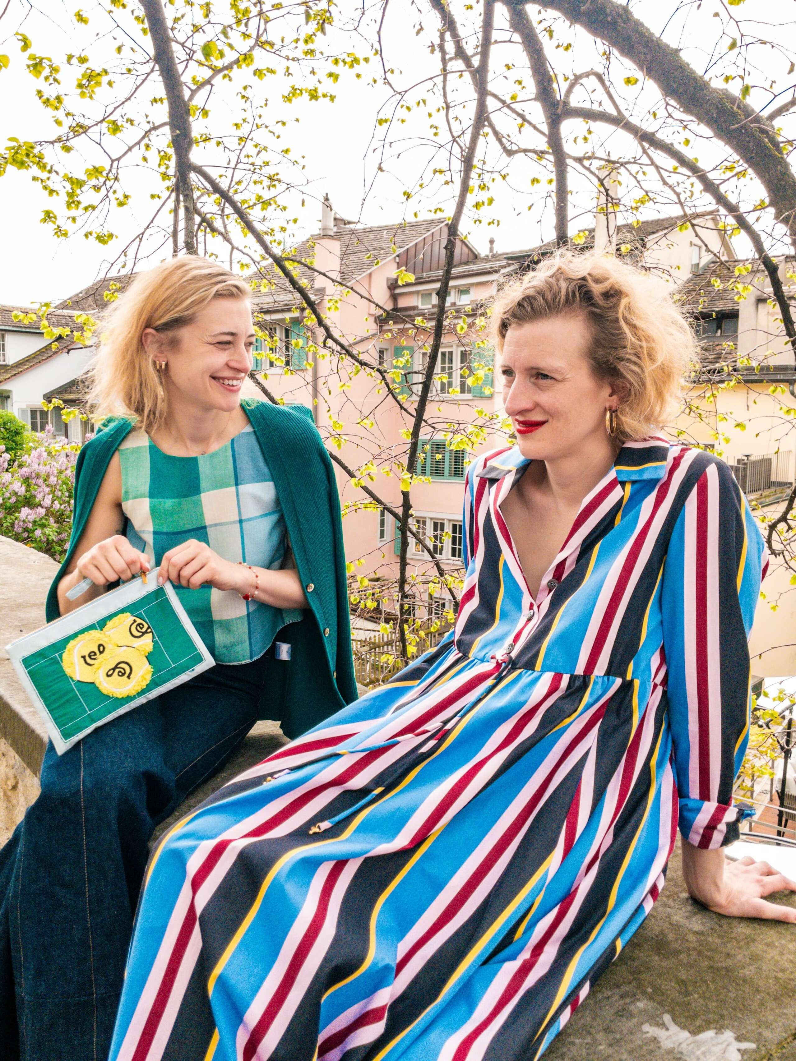 Picture of two women sitting outdoor on a sunny day