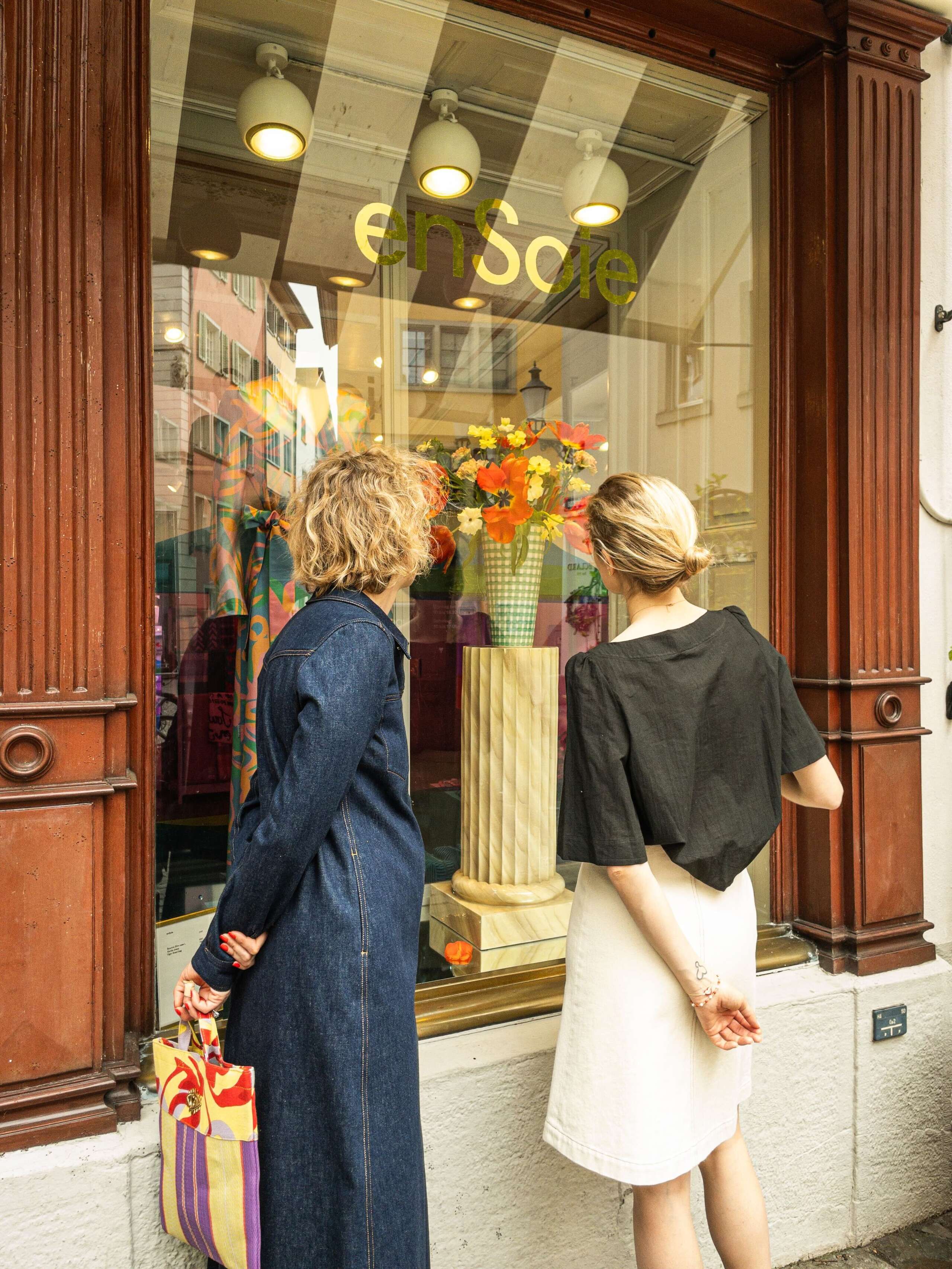 Picture of two women sitting outdoor on a sunny day