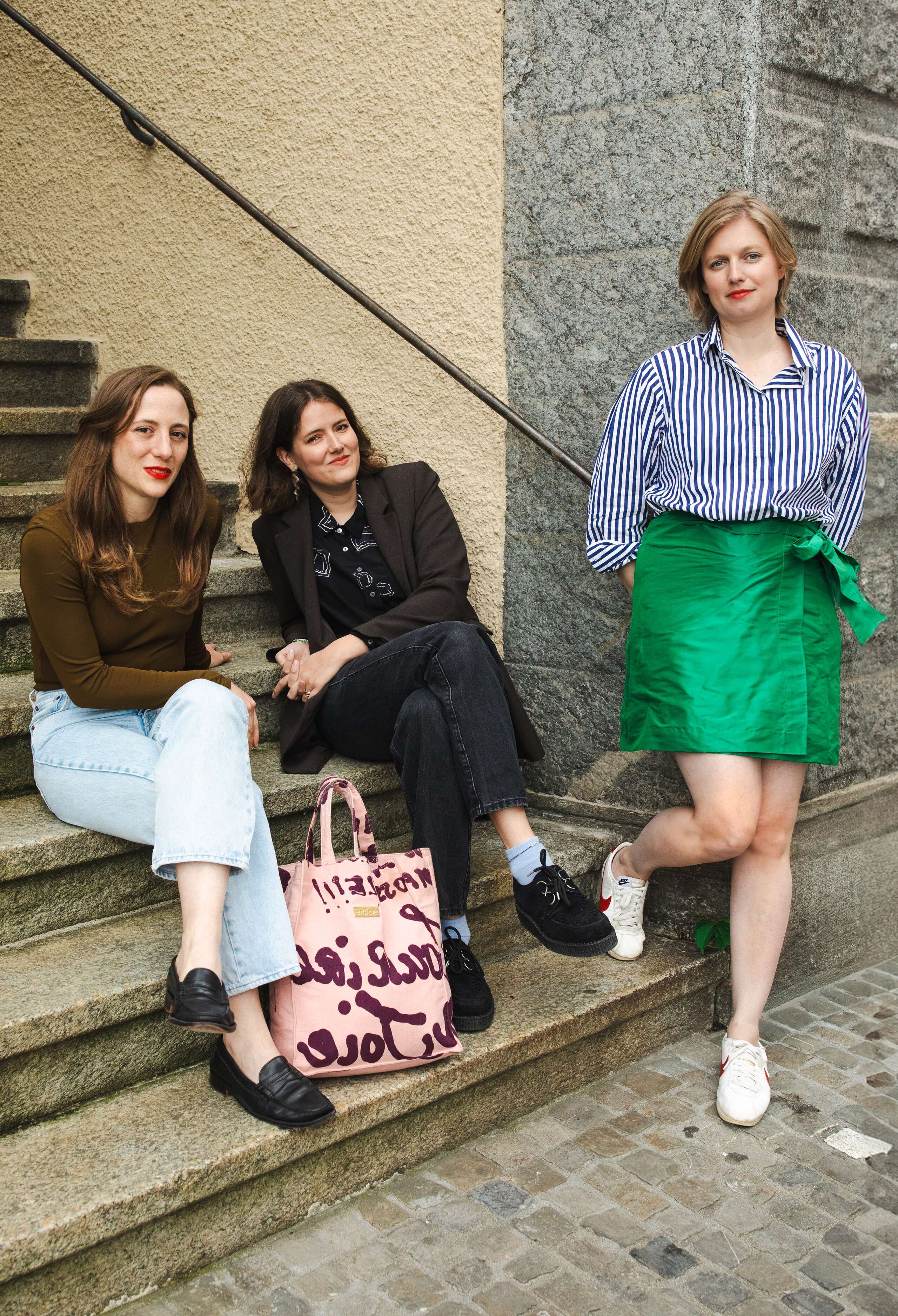 Picture of three young women sitting on a stairway
