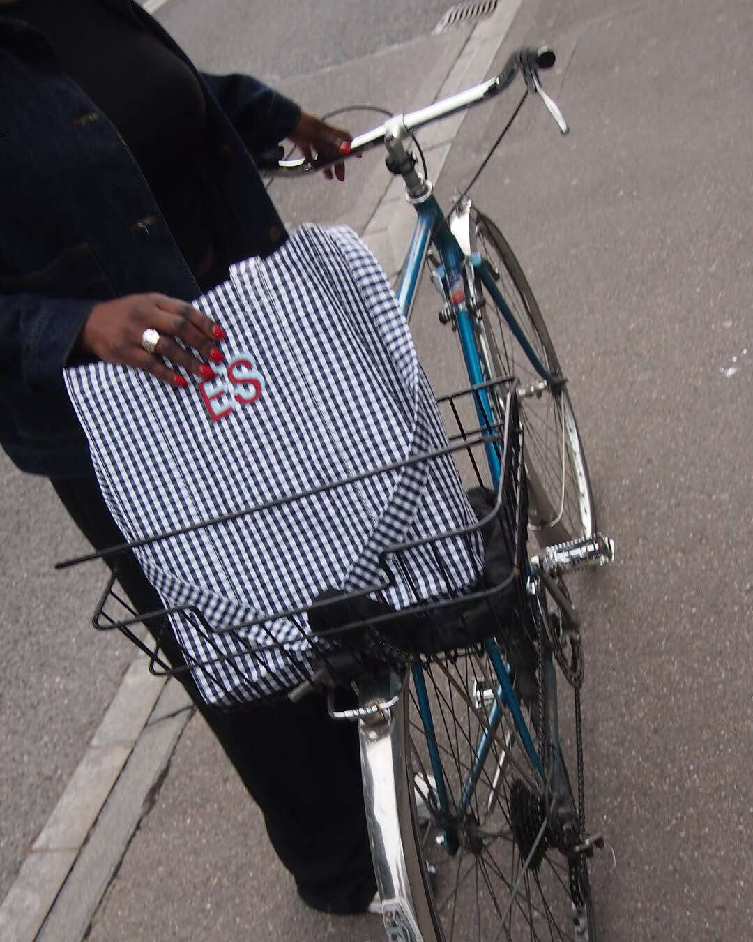 Picture of a women standing next to a bike