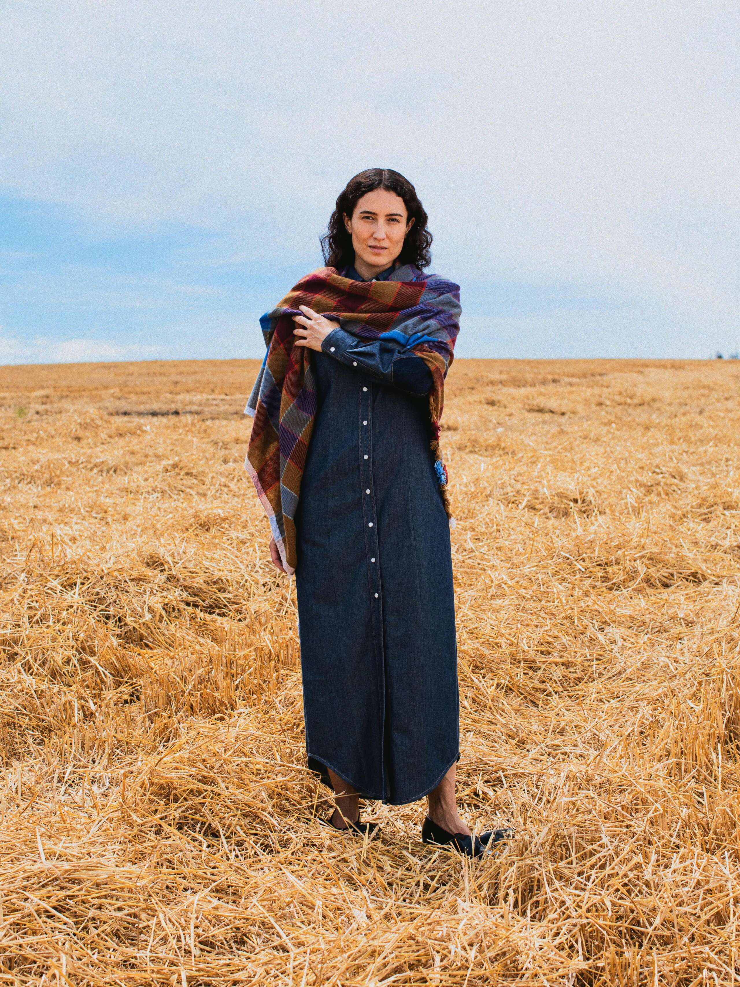 Picture of a female model wearing a denim dress