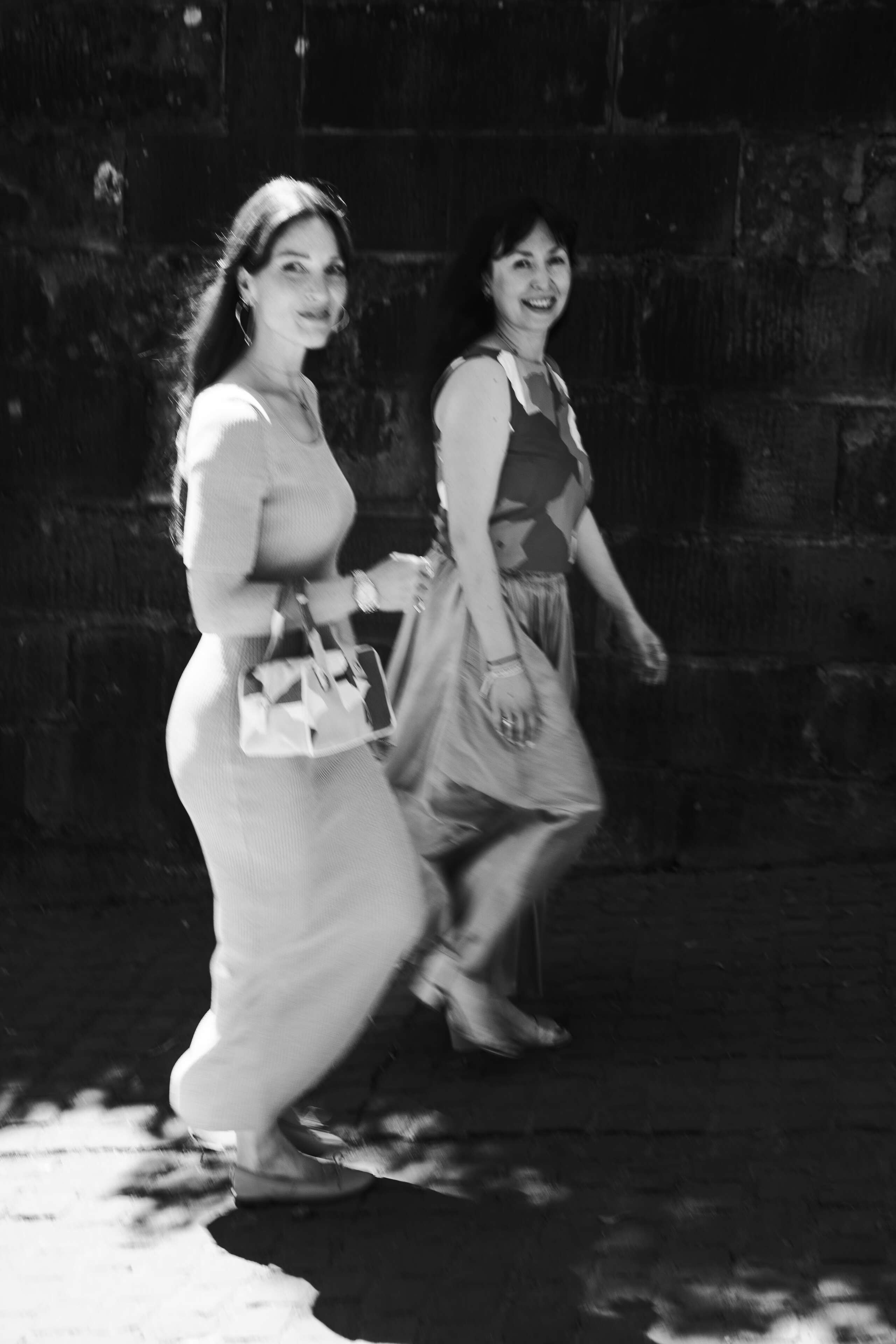 Two women walking down a stair