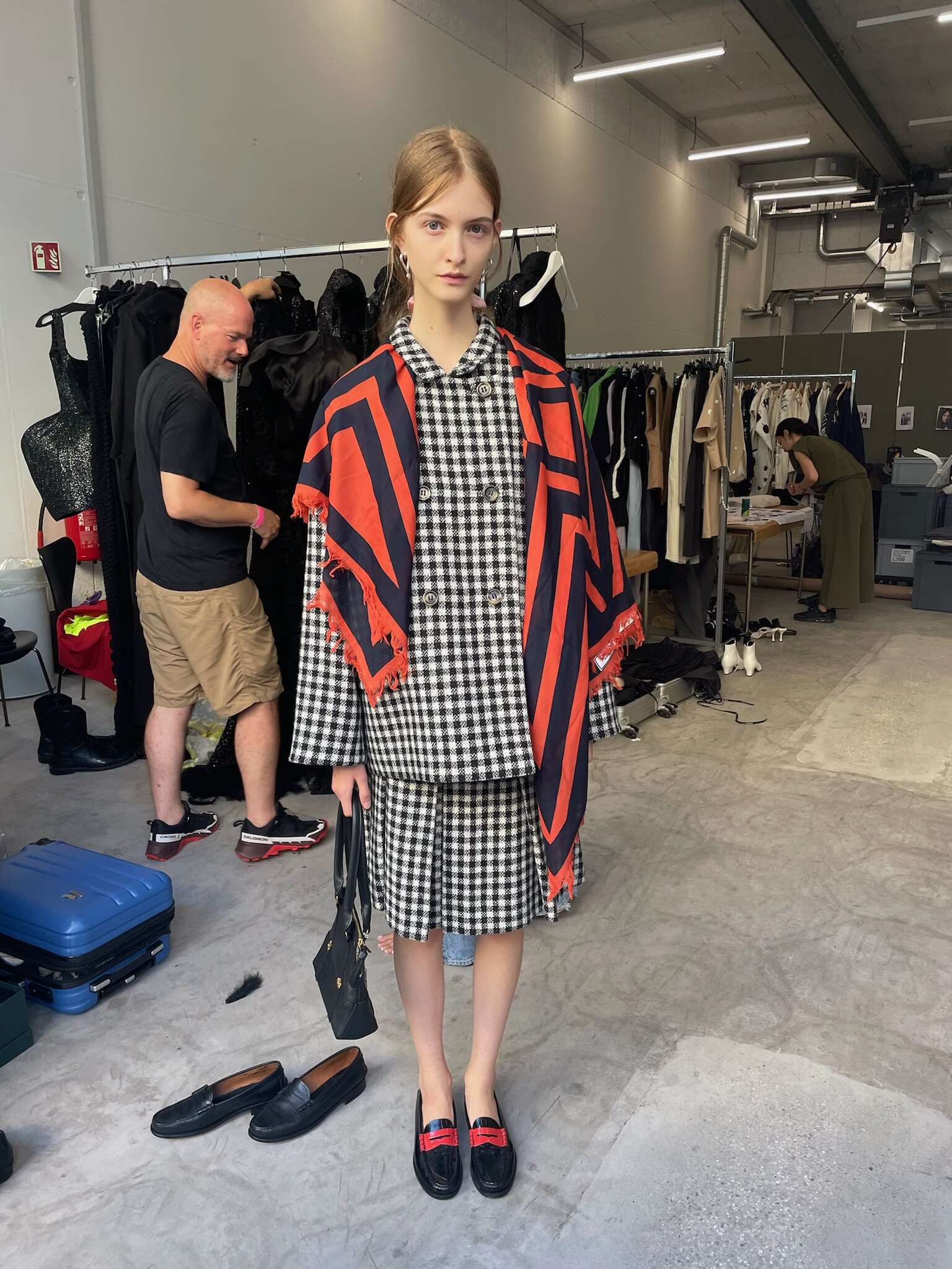 Picture of a model in the backstage of a fashion show