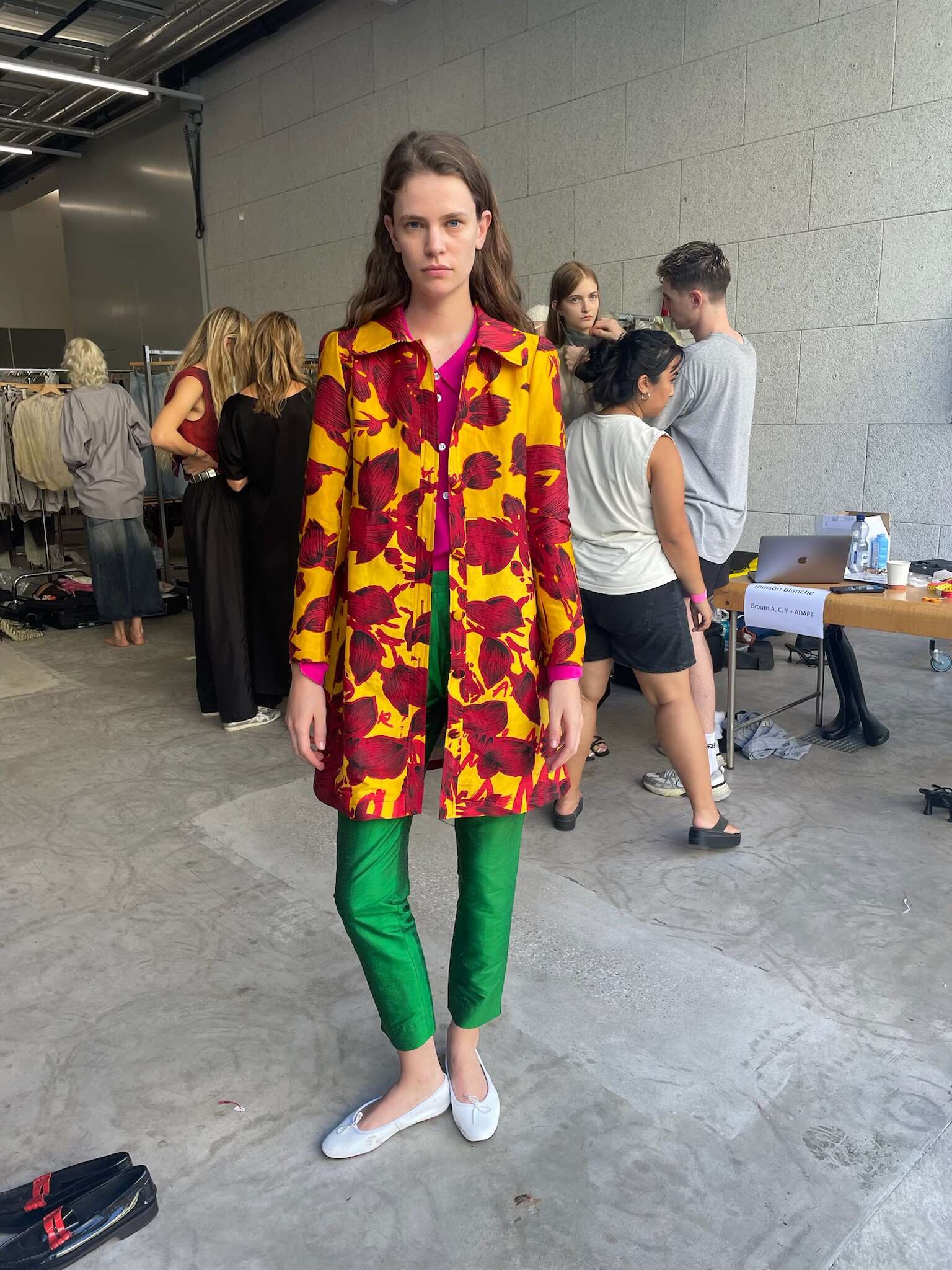 Picture of a model in the backstage of a fashion show