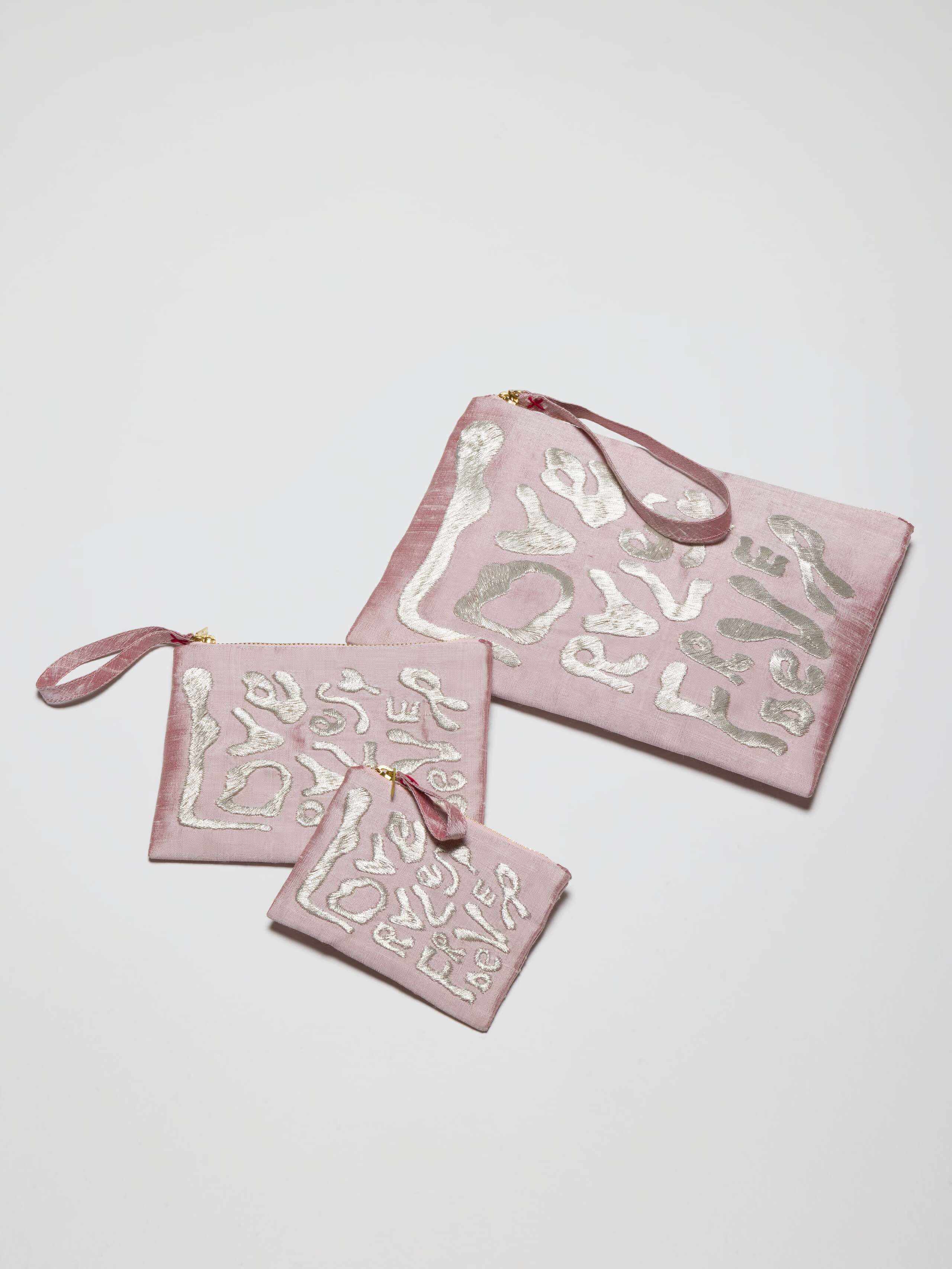 Picture of three pink silk clutches