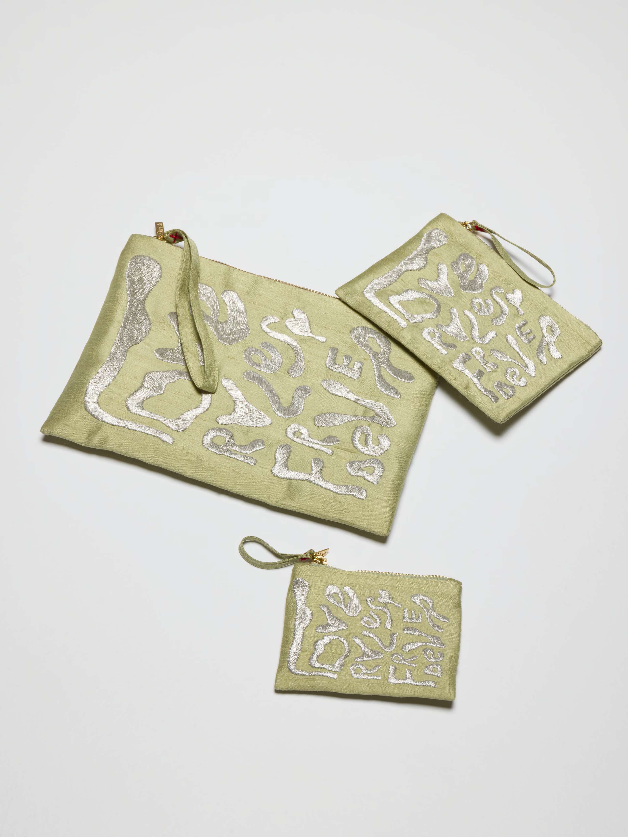 Picture of three green silk clutches