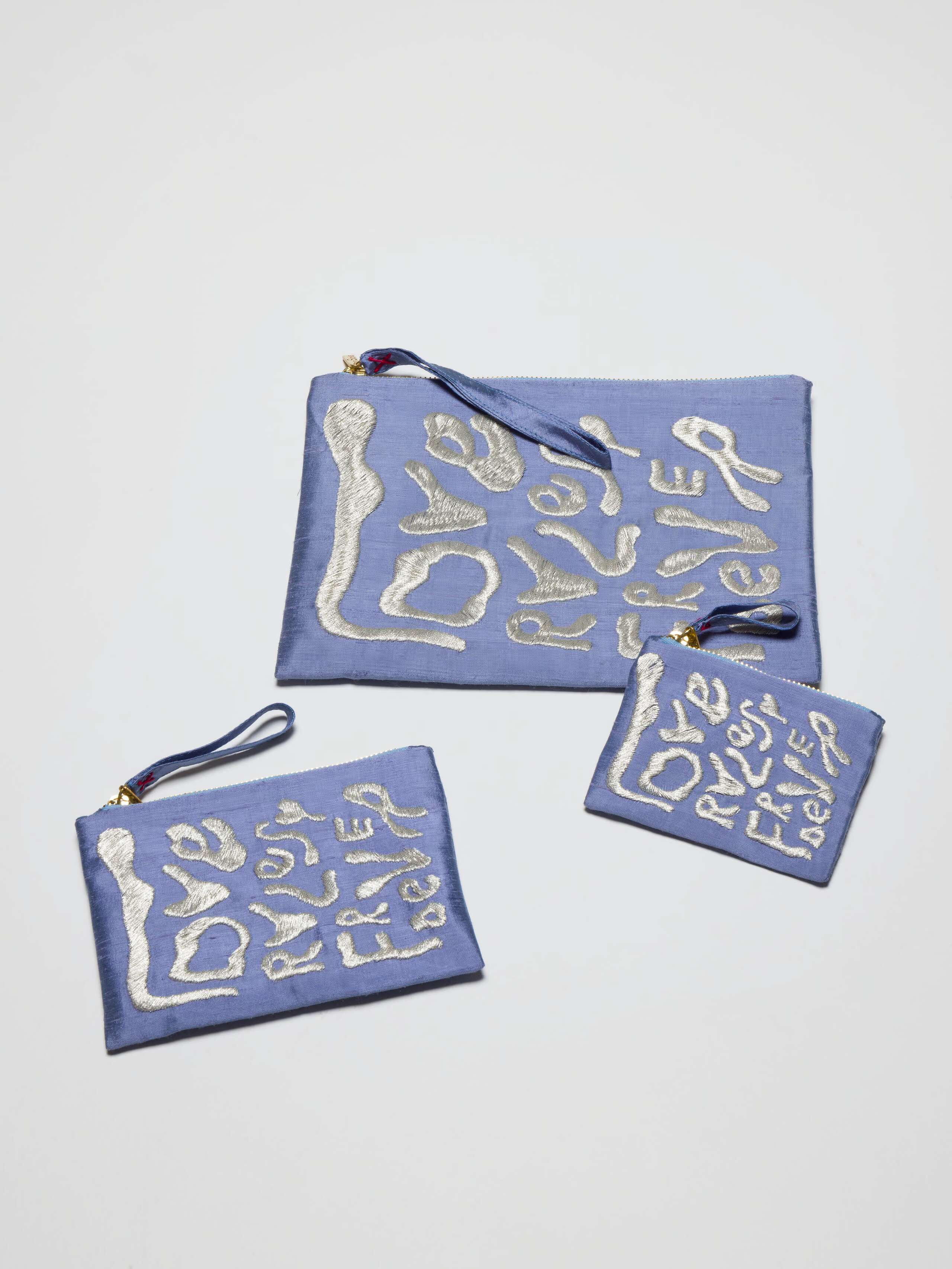 Picture of three blue silk clutches