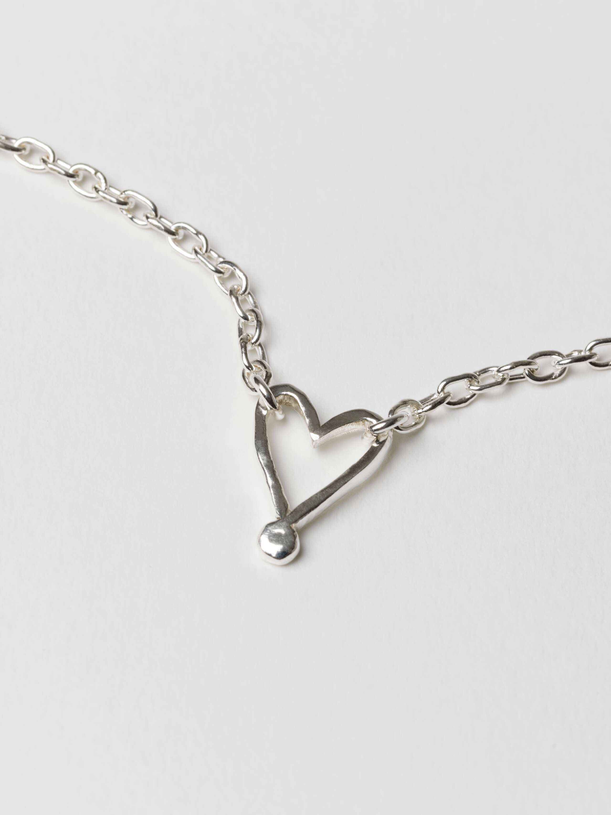 Alma heart necklace and bracelet detail