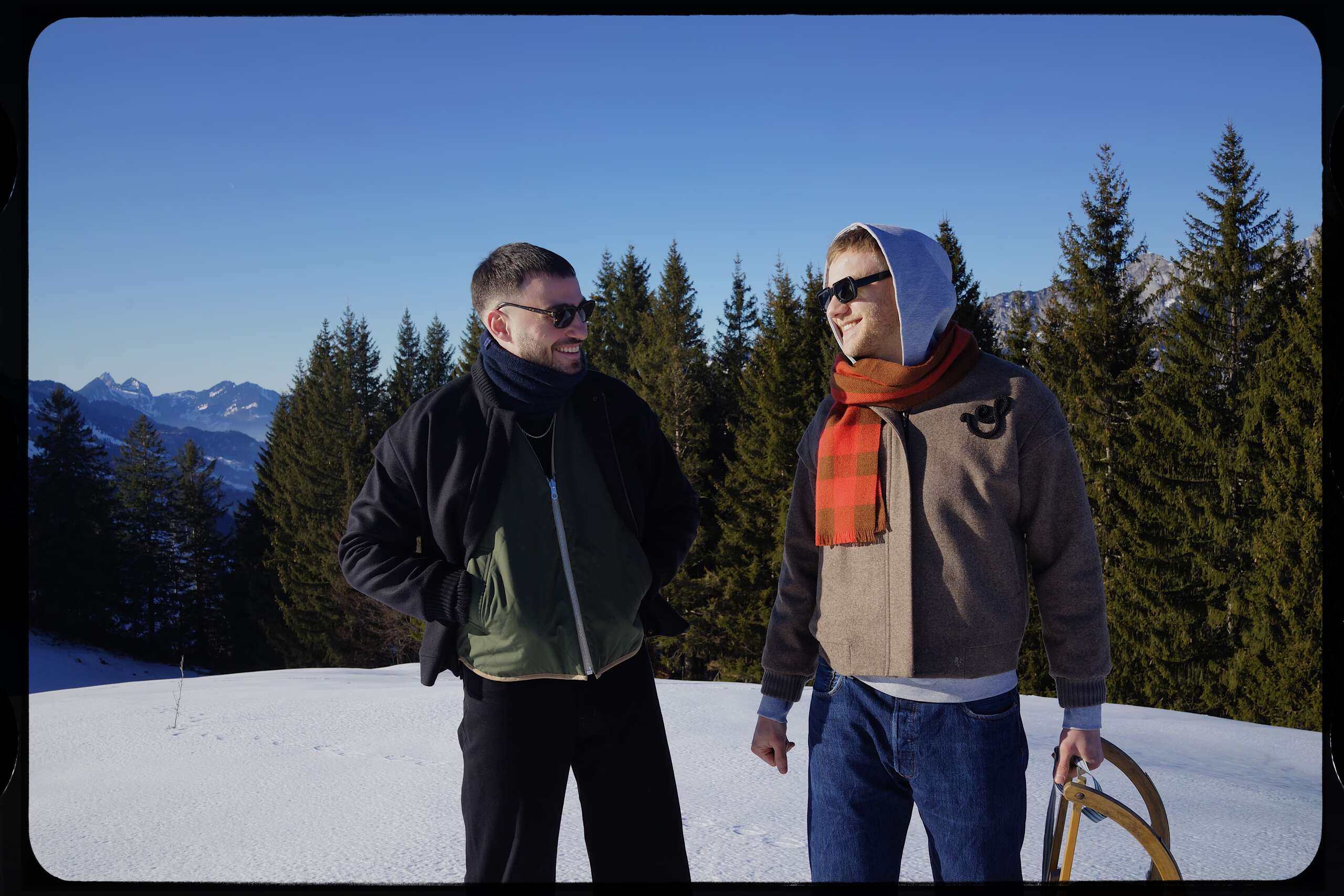 Picture of two young men standing in snow.
