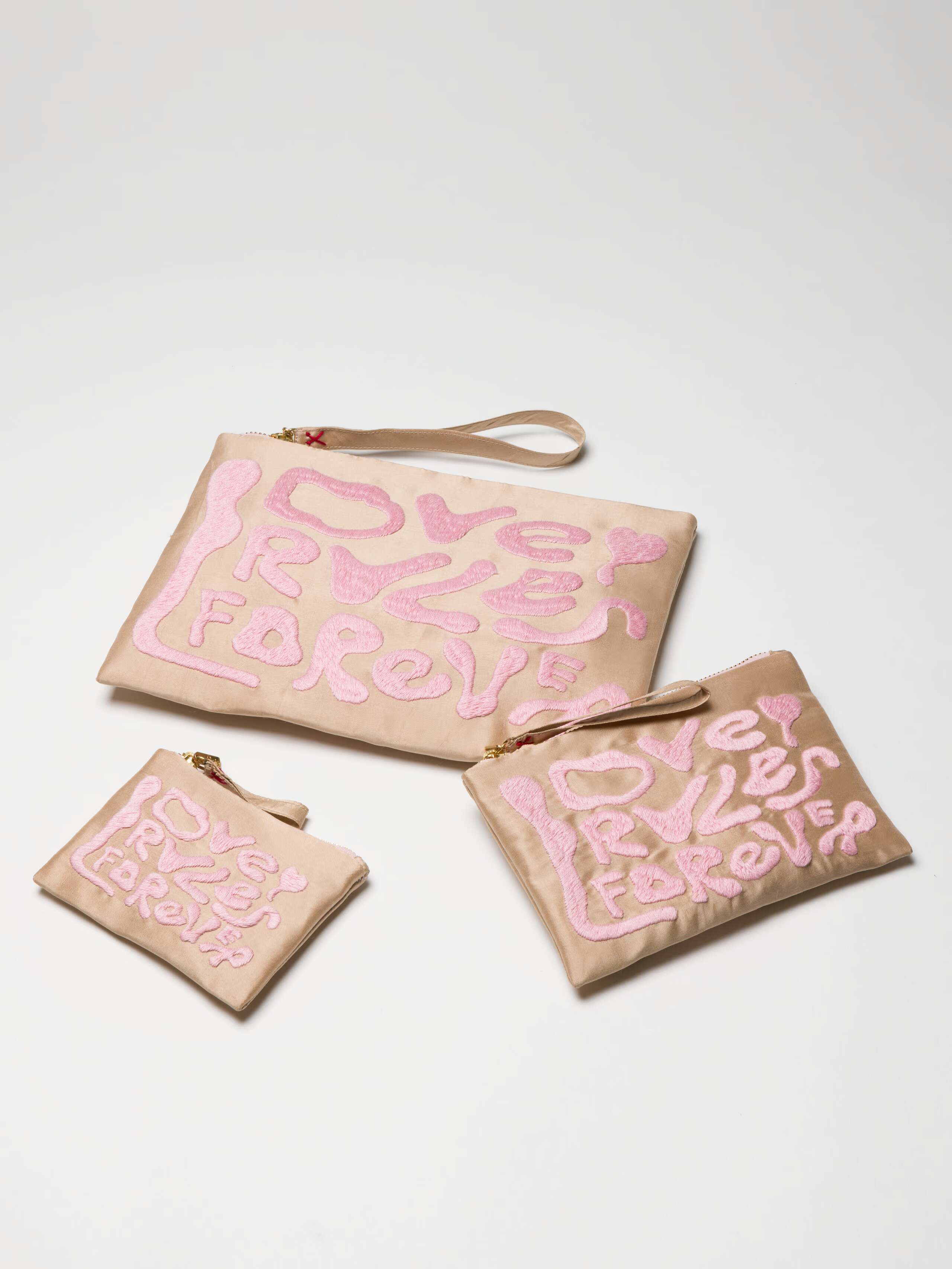 Love Rules forever pouches in gold beige
