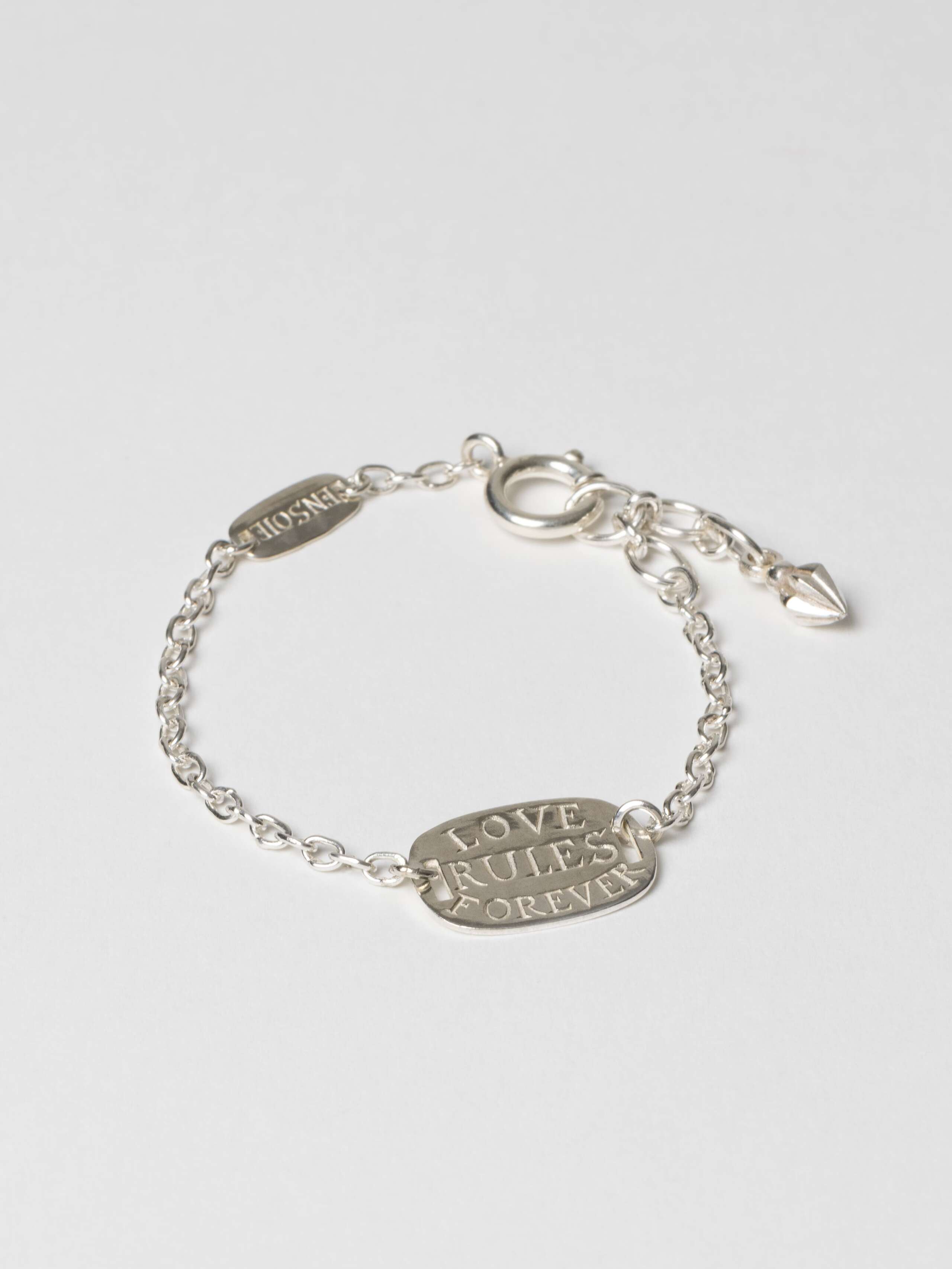 Love rules forever tag bracelet, front view of tag