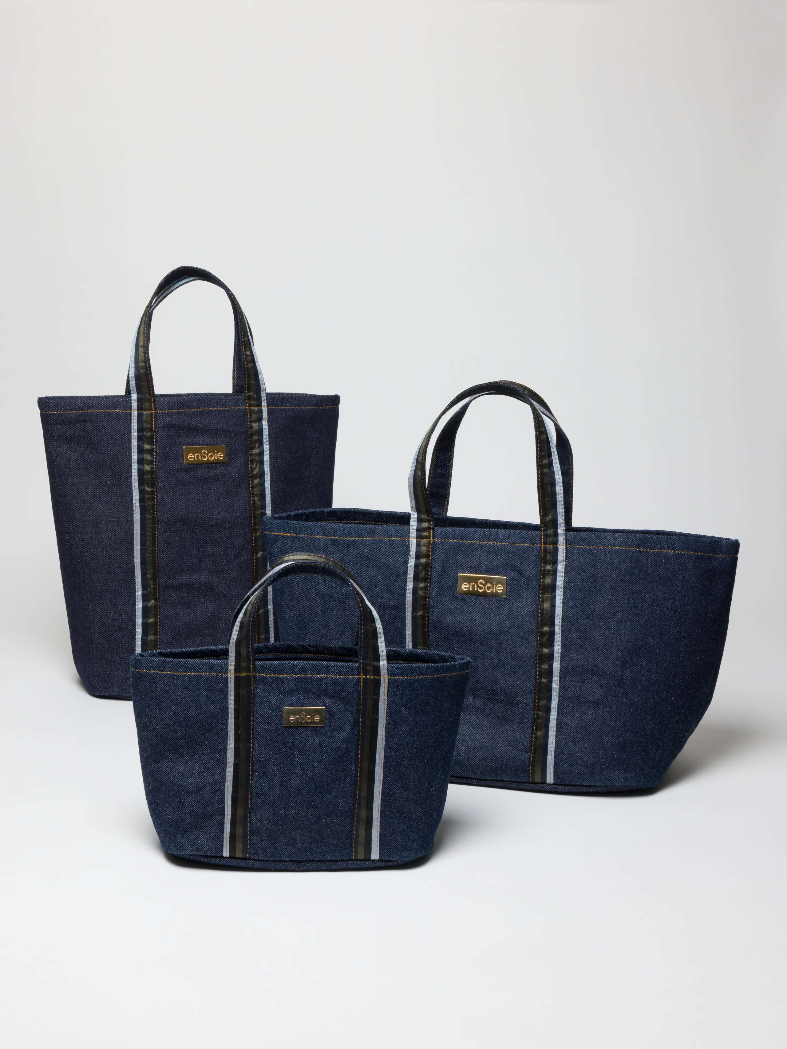 Upstate bag in denim featuring handles in three doupion silk colours combined and brasstag featuring ensoie logo in three sizes
