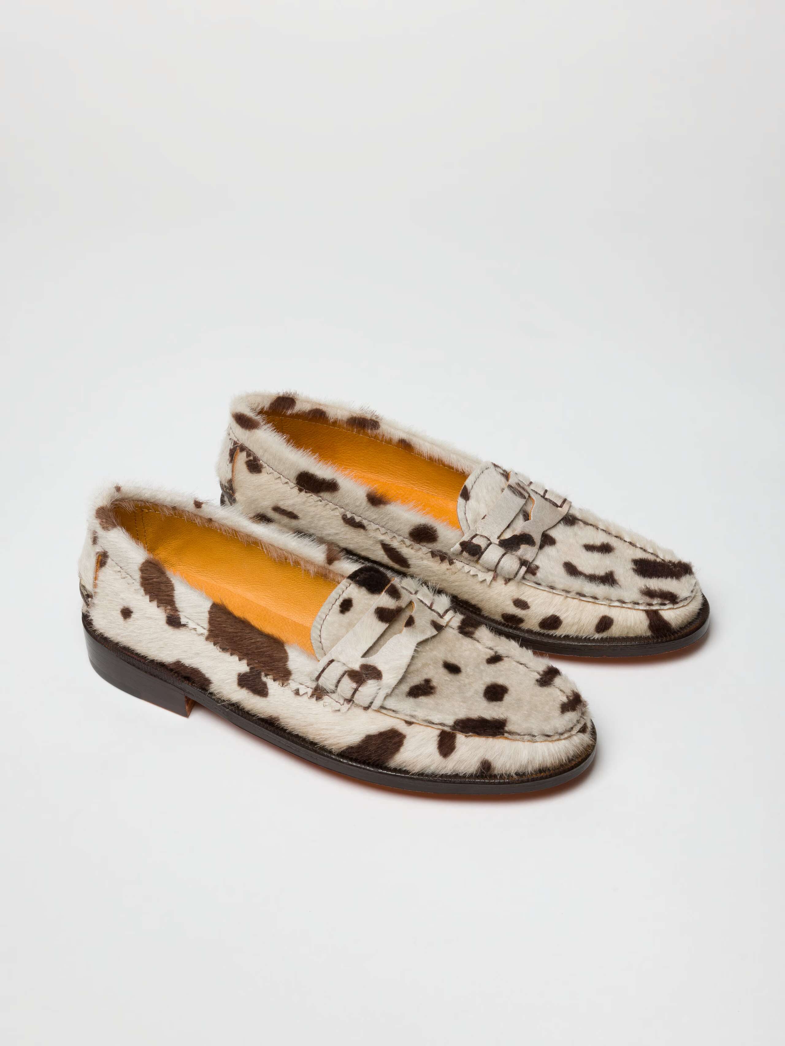 Pair of Cowhide loafers in white and brown handmade