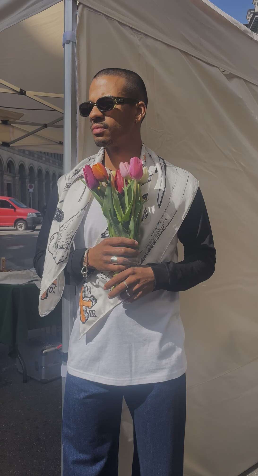Picture of a young man holding flowers