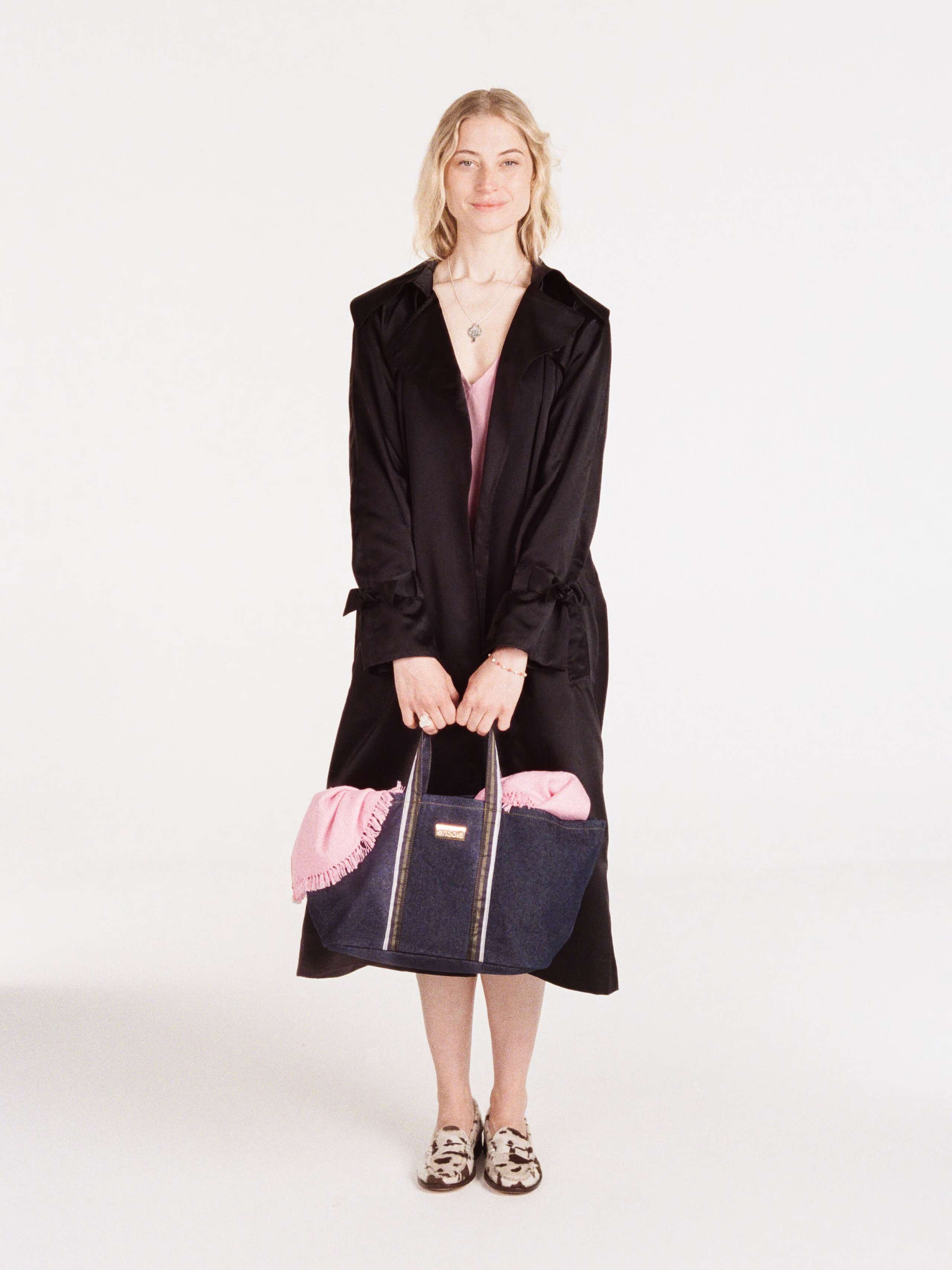 Anna wearing the Manhattan coat in black