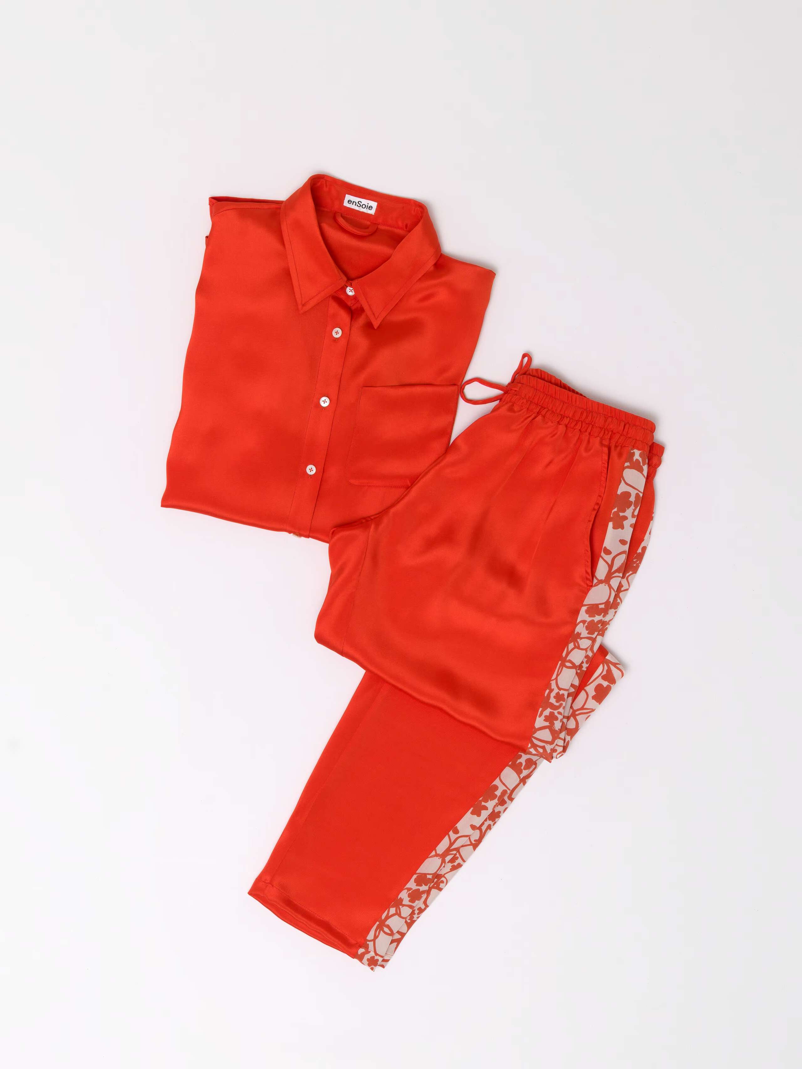 Jetlag two piece set tracksuit in one-of a kind silk orange with flowers print on the side