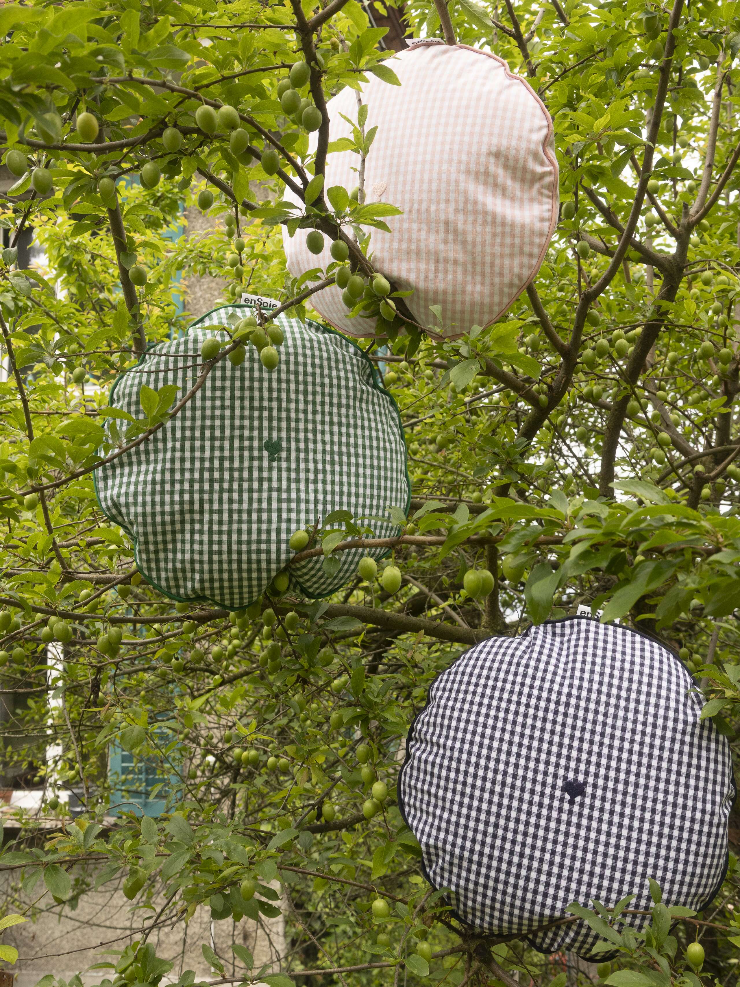 Picture of three vichy check round pillows