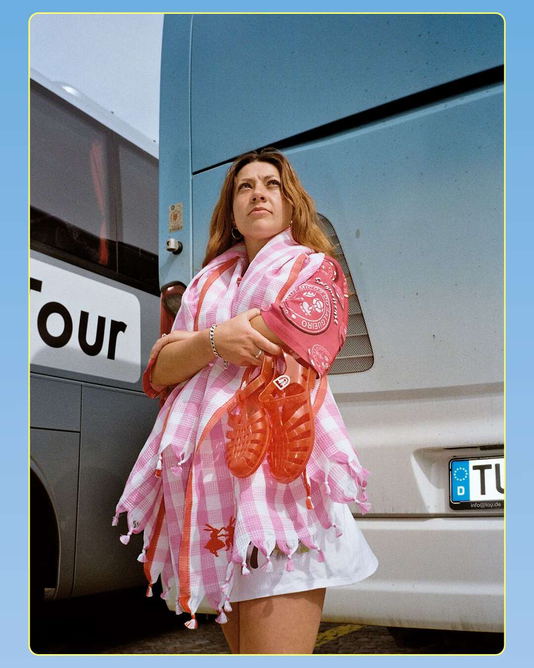 Picture of a women waiting in front of a bus