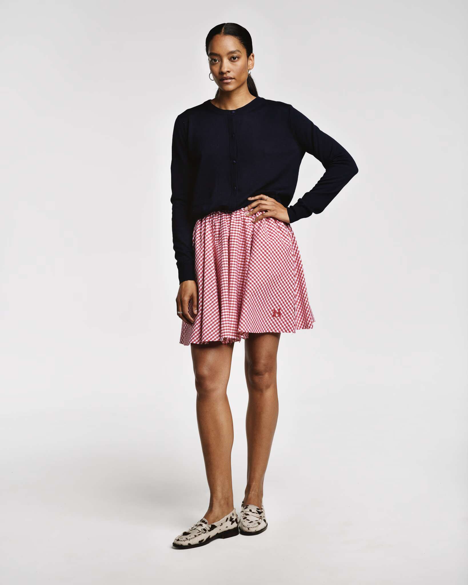 Model wearing the Berta short skirt in vichy check red