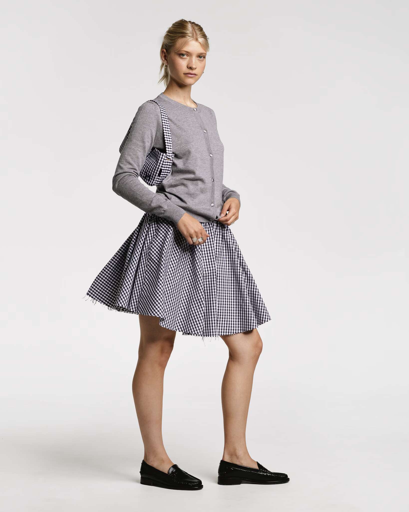 Models wearing the Berta short skirt in vichy check red and Black