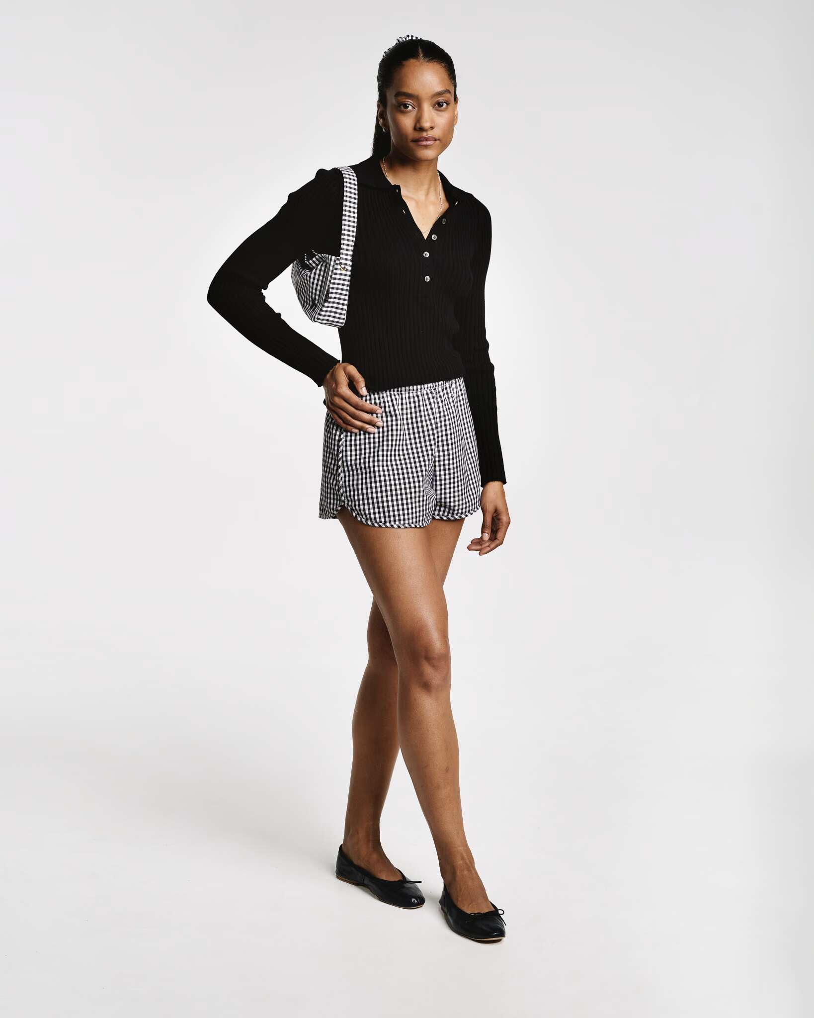 Model wearing the black vichy check dionne shorts