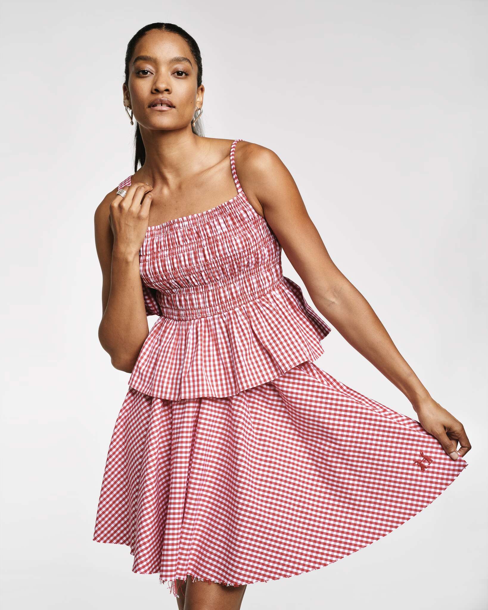 Model wearing the red vichy Val top