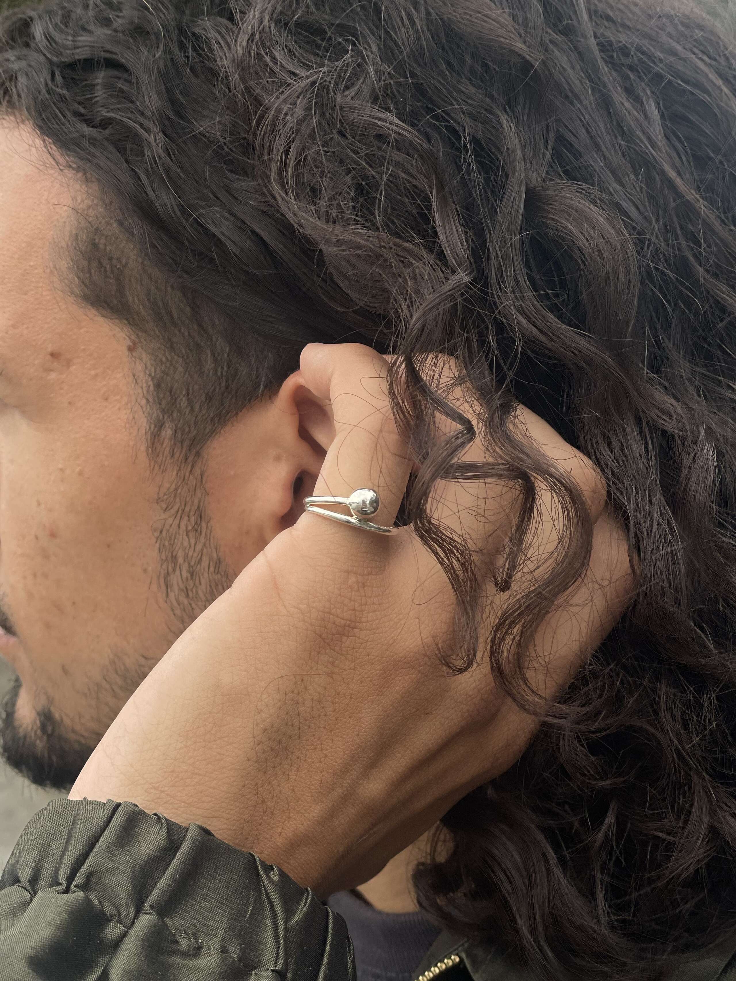 Model wearing pushpin ring