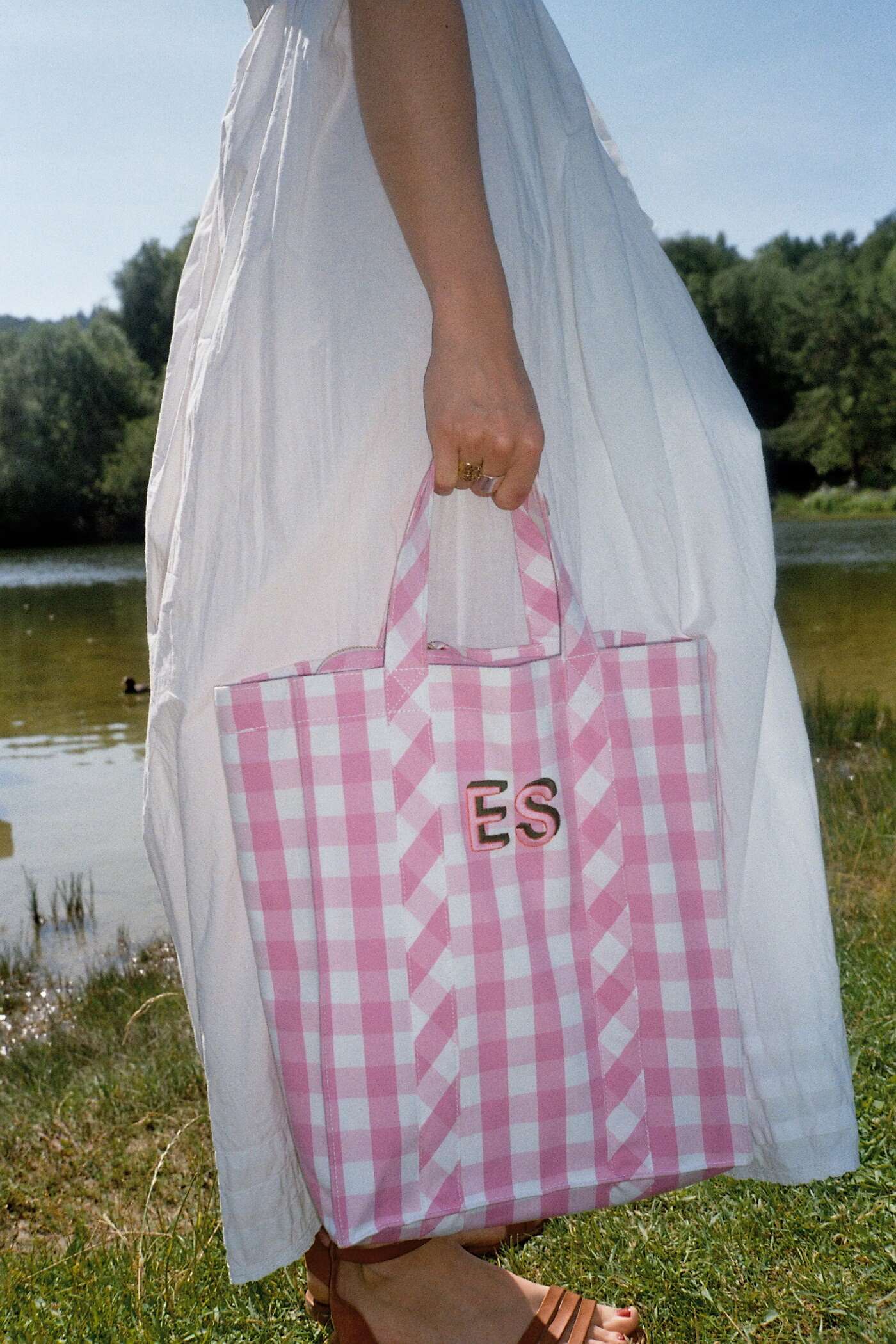 model wearing personlised cabas bag in rose garden