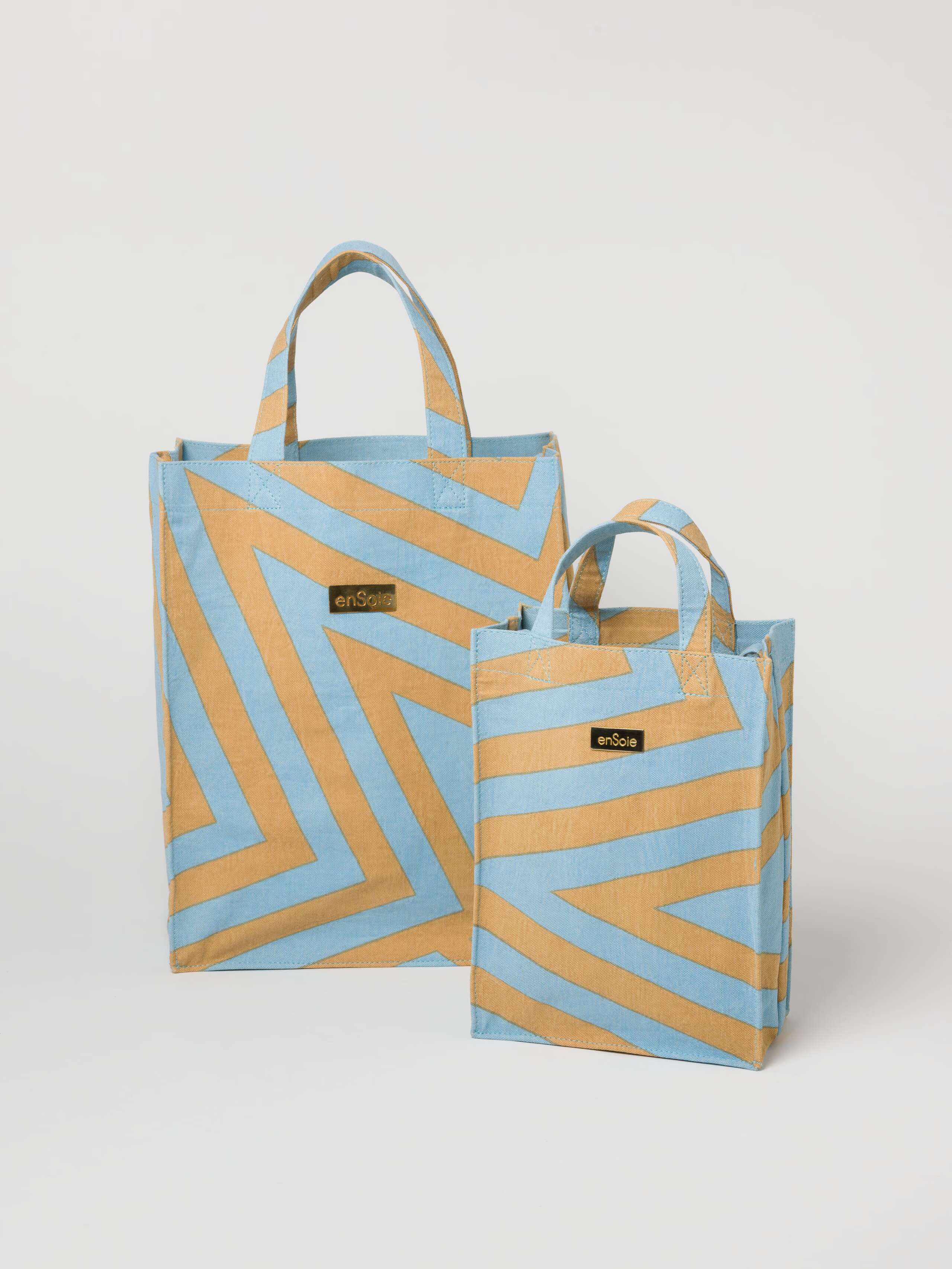 Picture of two canvas bags in beige and light blue shades