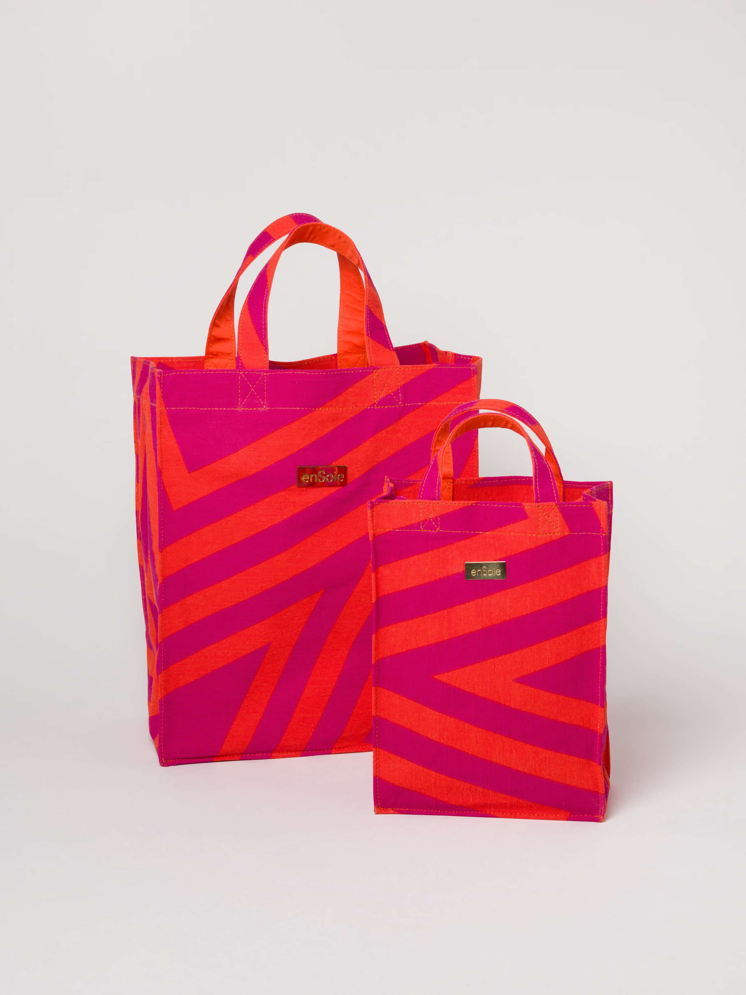 Picture of two canvas bags in pink and orange shades