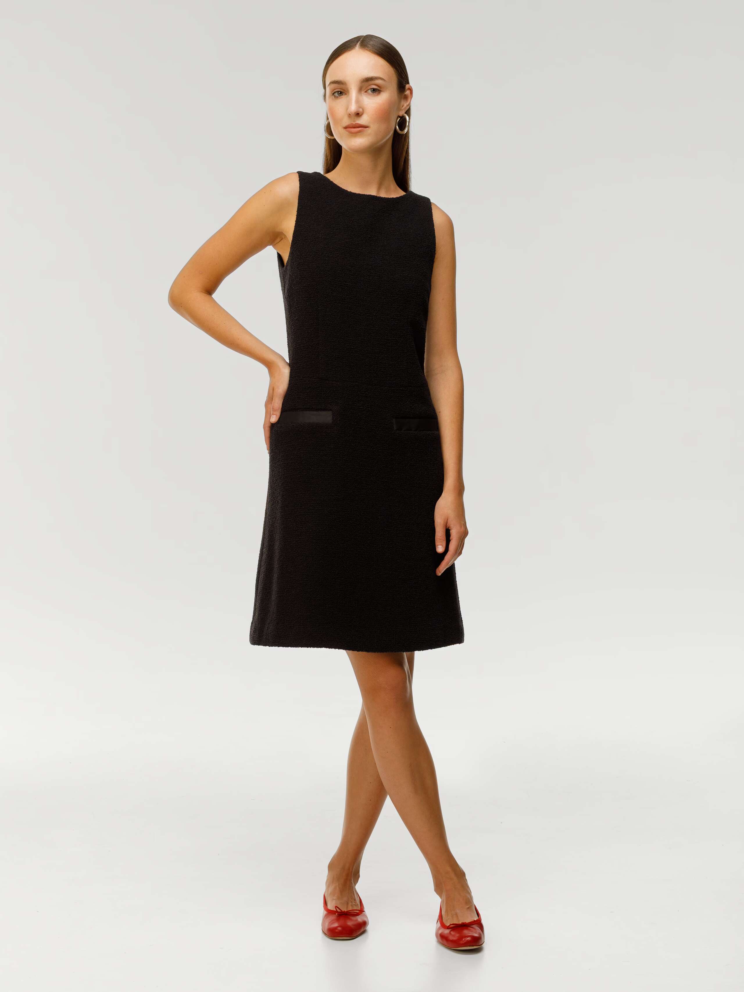 Bellina dress in black bouclé wool worn by model