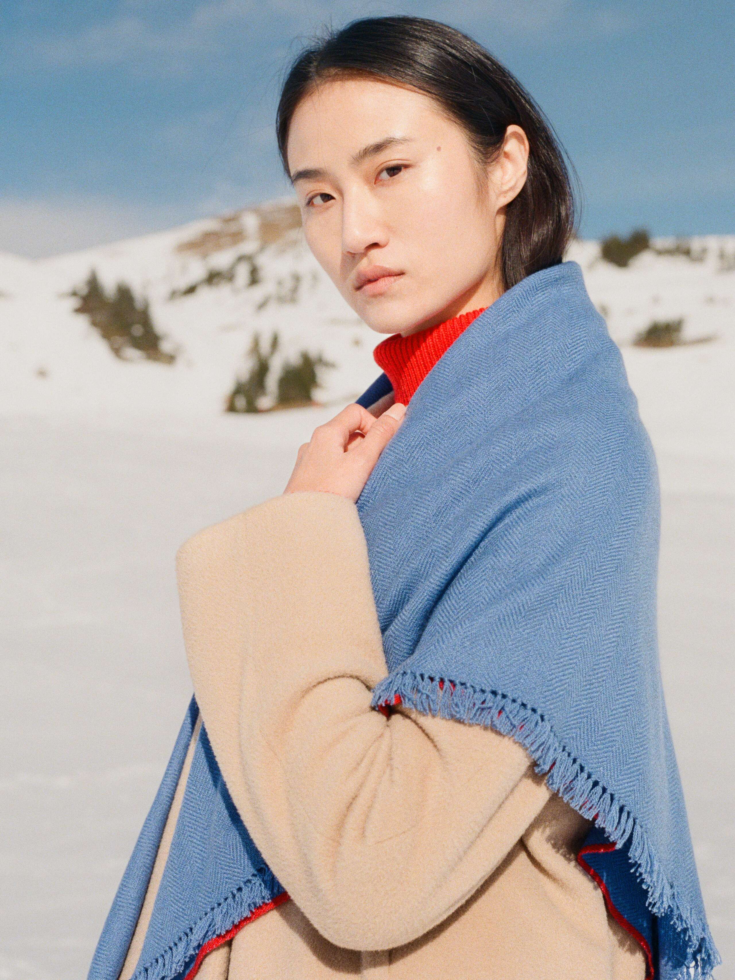 Picture of a women wearing a blue cashemre stole
