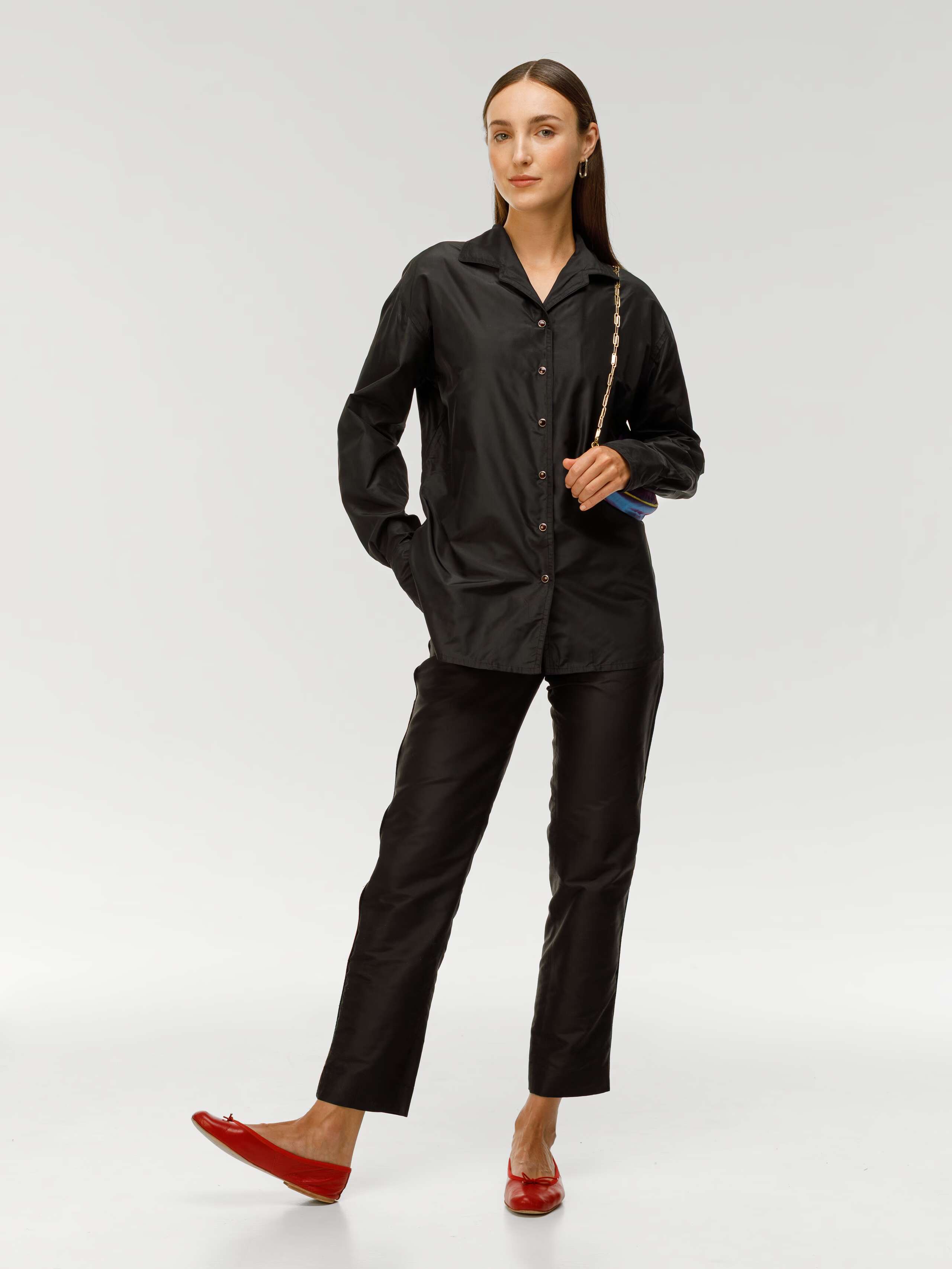 Diane black trousers in silk, worn by model